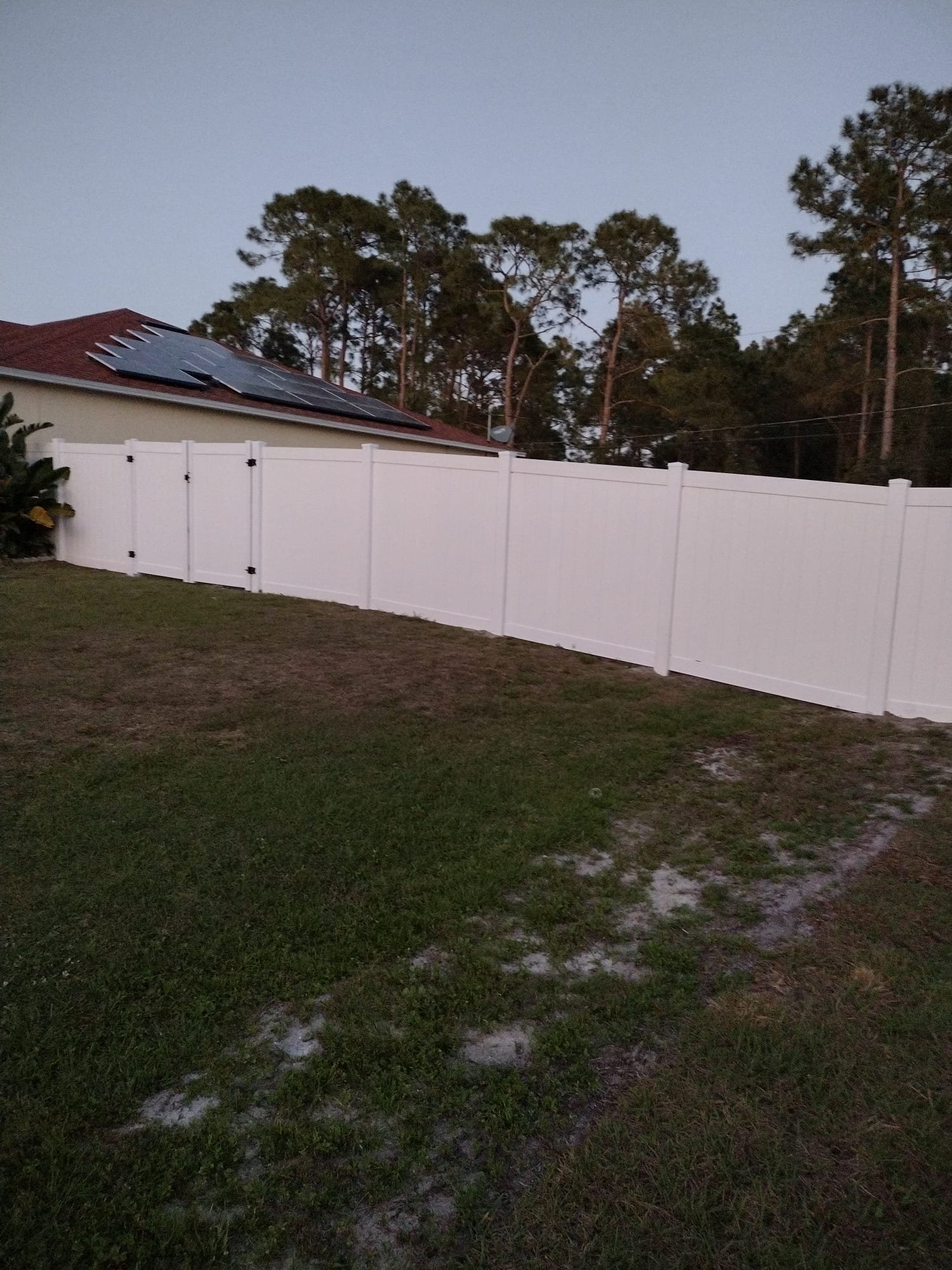Vinyl privacy fence along Florida residential property line