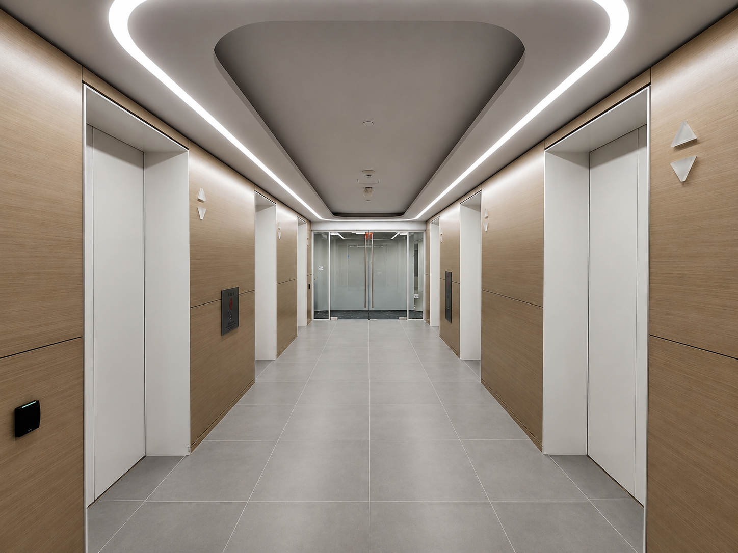 Modern elevator lobby with wood panel walls, gray tiled floor, and ceiling with recessed lighting and a central gray design element. Glass double doors are at the end of the hallway.