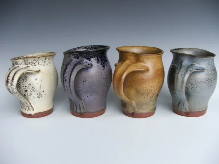 four mugs in Jessica's signature colours