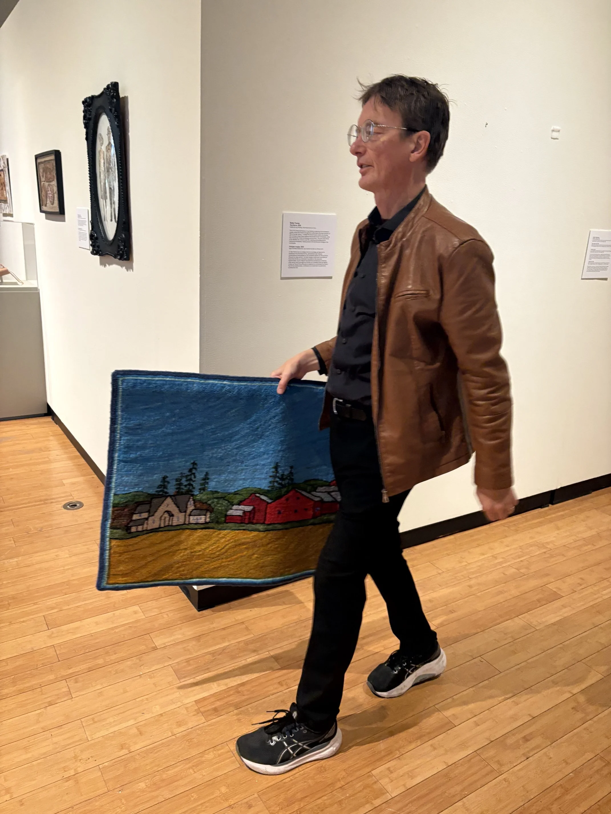 hanging an exhibit with Pan