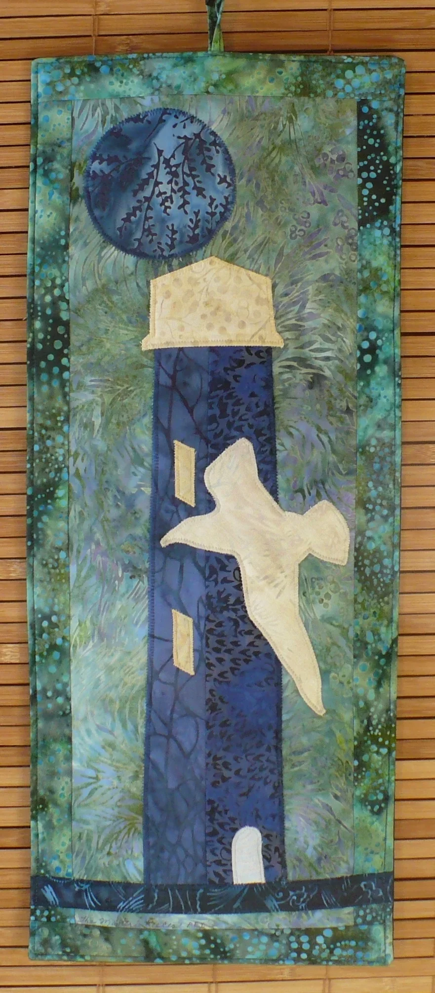 lighthouse and bird wall hanging