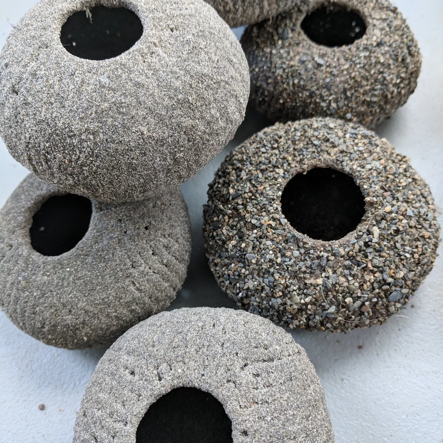 small sand encrusted islets, sand collected from various beaches