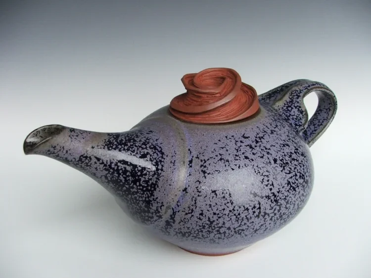 blue teaport with unusual spiral lid