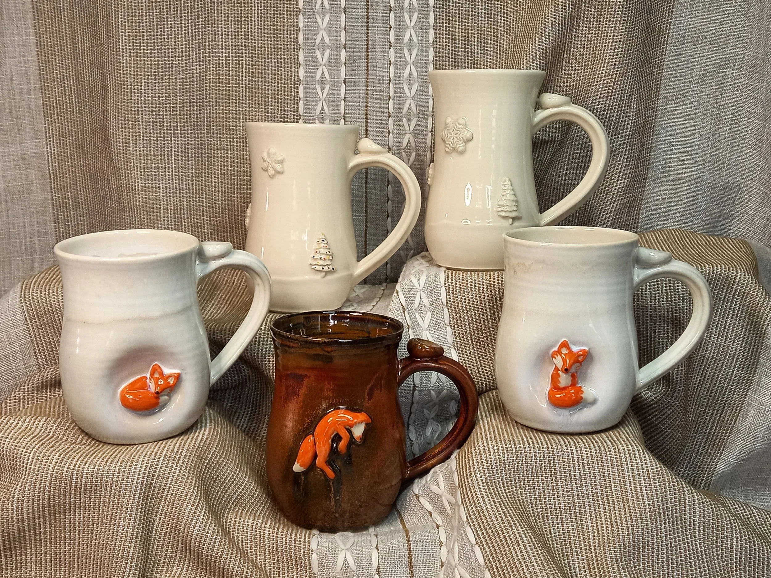 fox mugs, sleeping, jumping and sitting and winter mugs