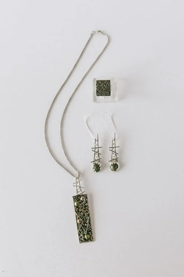 pendant, earrings and a ring