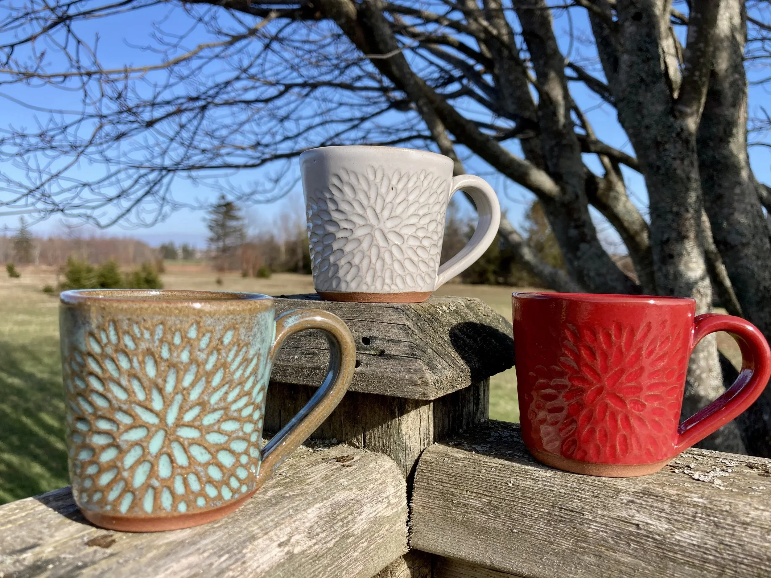 carved pottery mugs