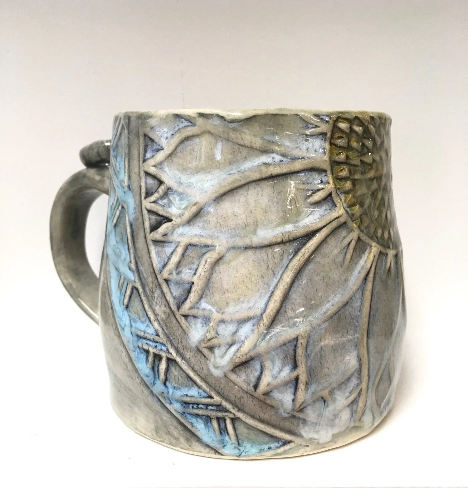 carved sunflower pottery mug
