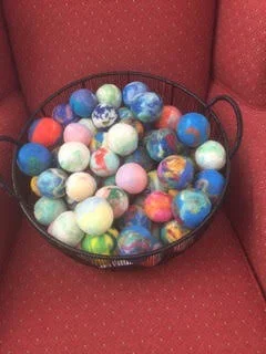 basket of colored dryer balls