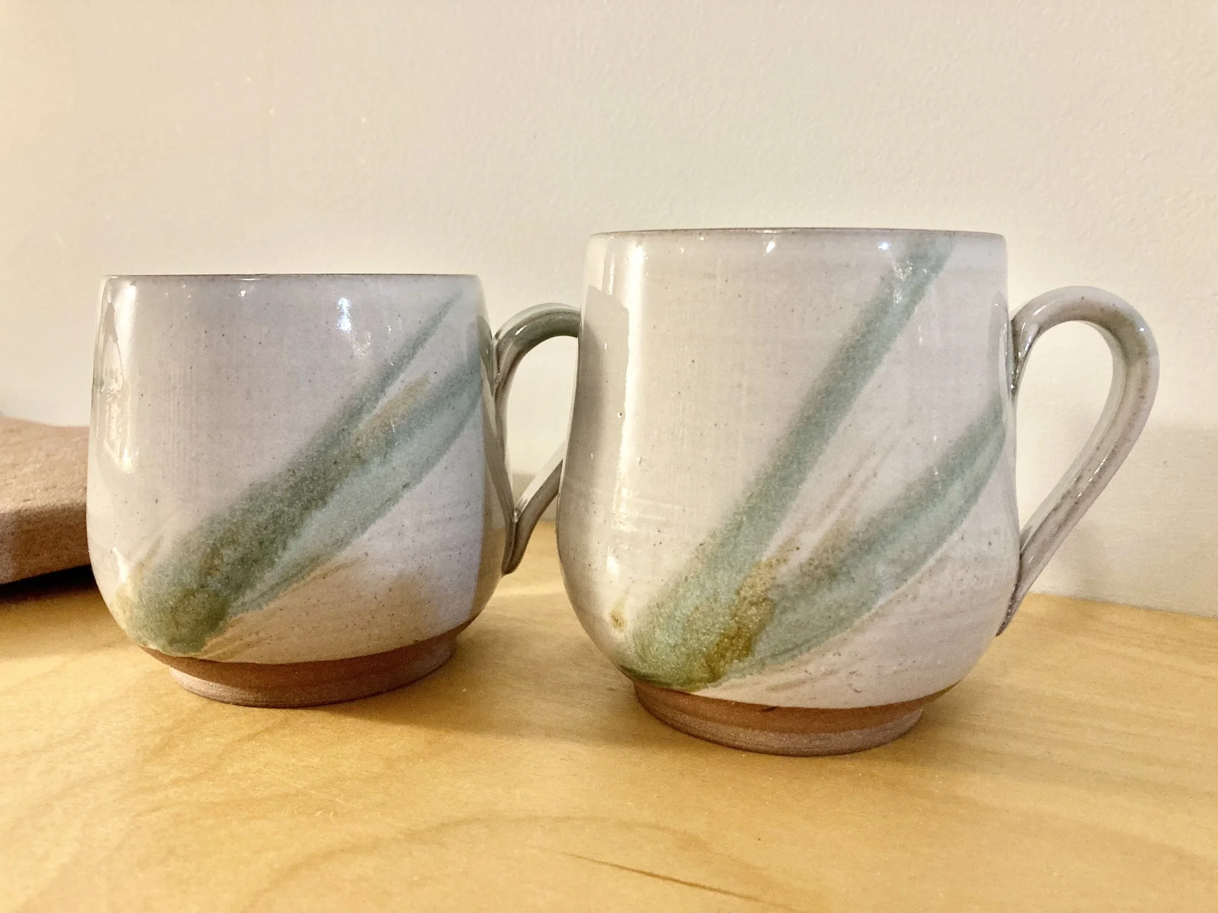 pottery mug with leaf design