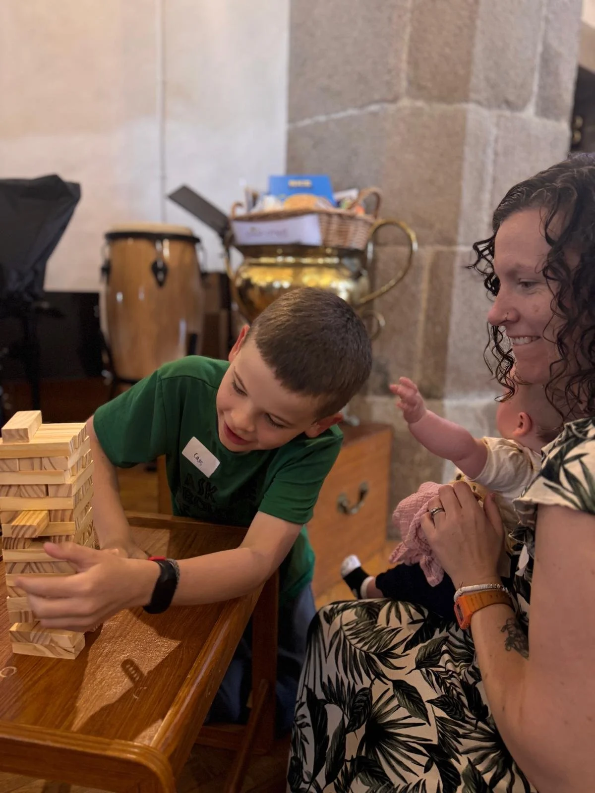 Mother and son playing jenga