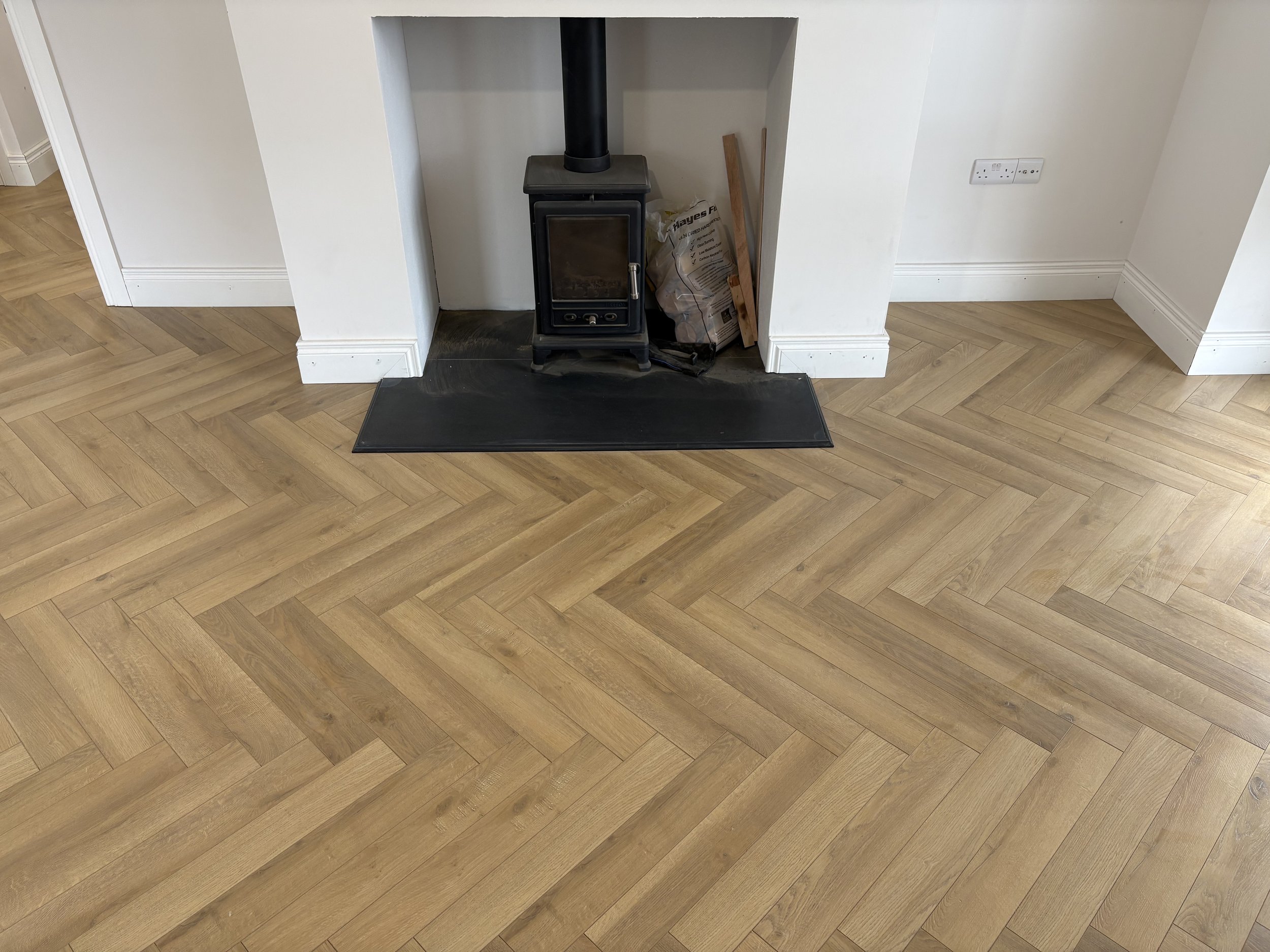 Antrim Living Room Herringbone Laminate After 2.jpeg