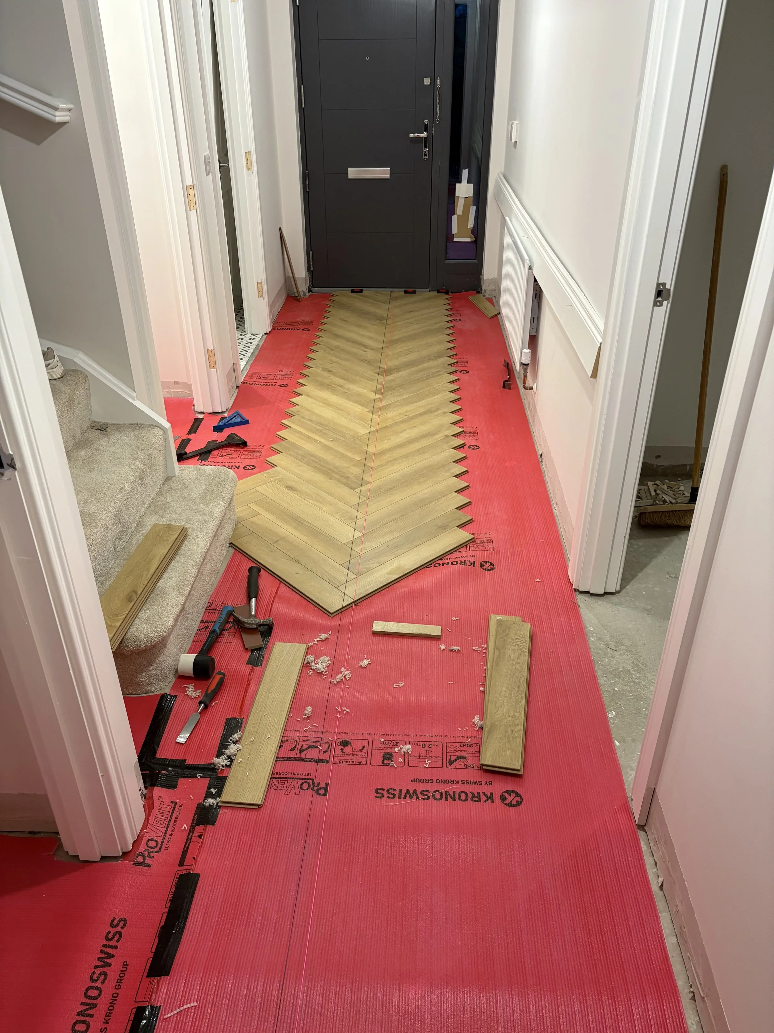 Antrim Hallway Herringbone Laminate Before 1.jpeg