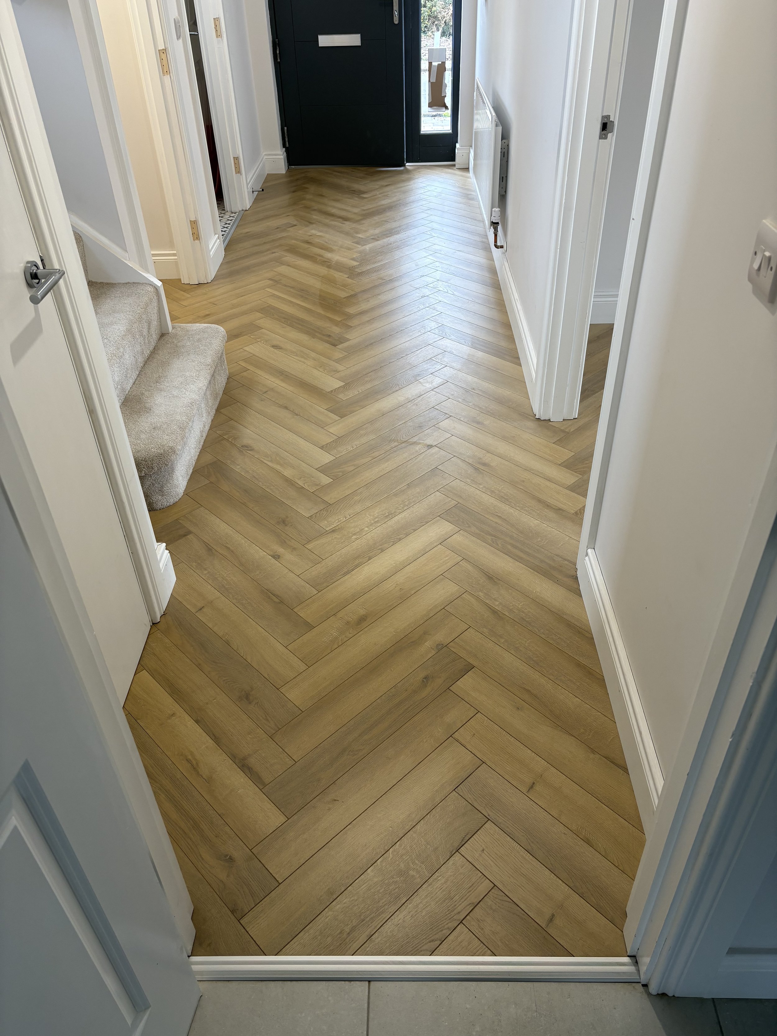 Antrim Hallway Herringbone Laminate Finished.jpeg