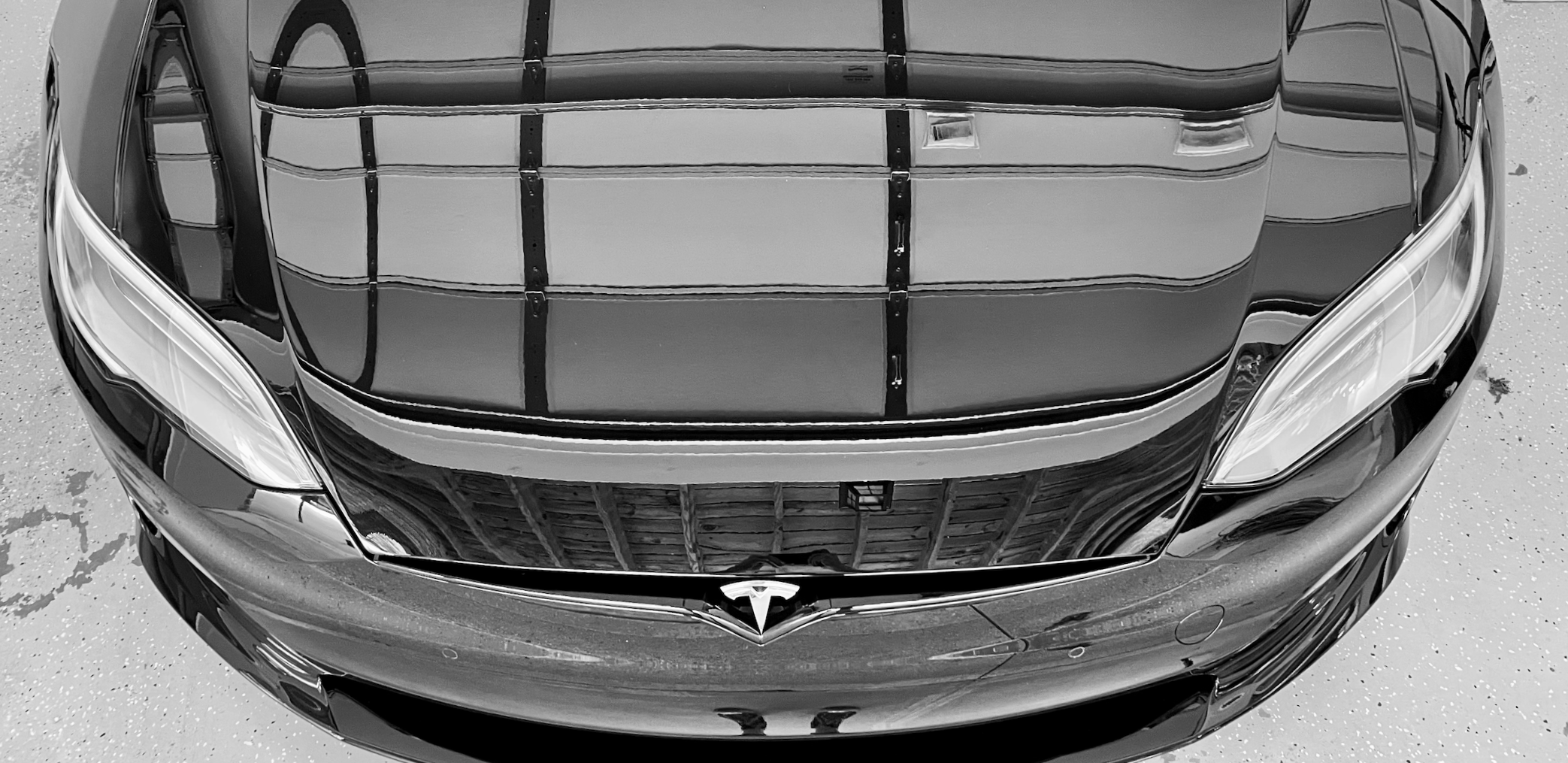 Front view of a black Tesla electric car with a ceramic coating in Atlanta Georgia