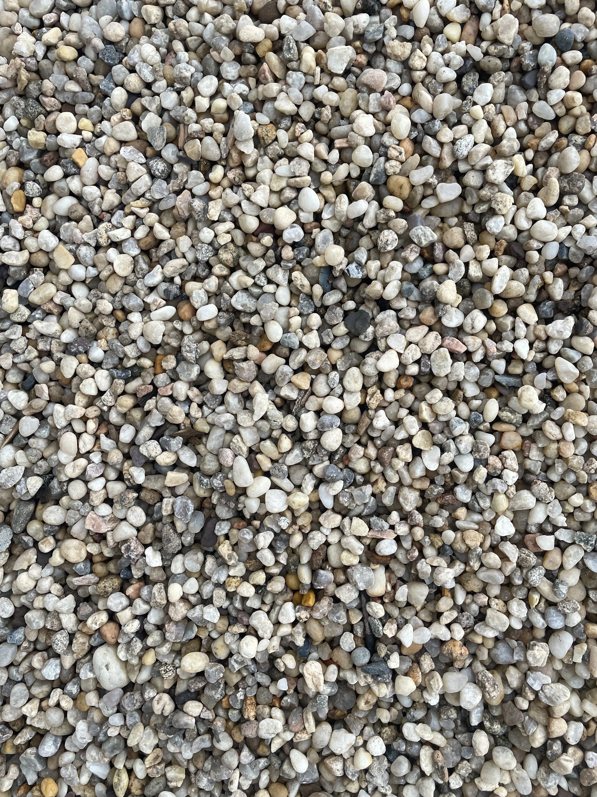 Close-up of small, rounded 3/8" round gravel stones