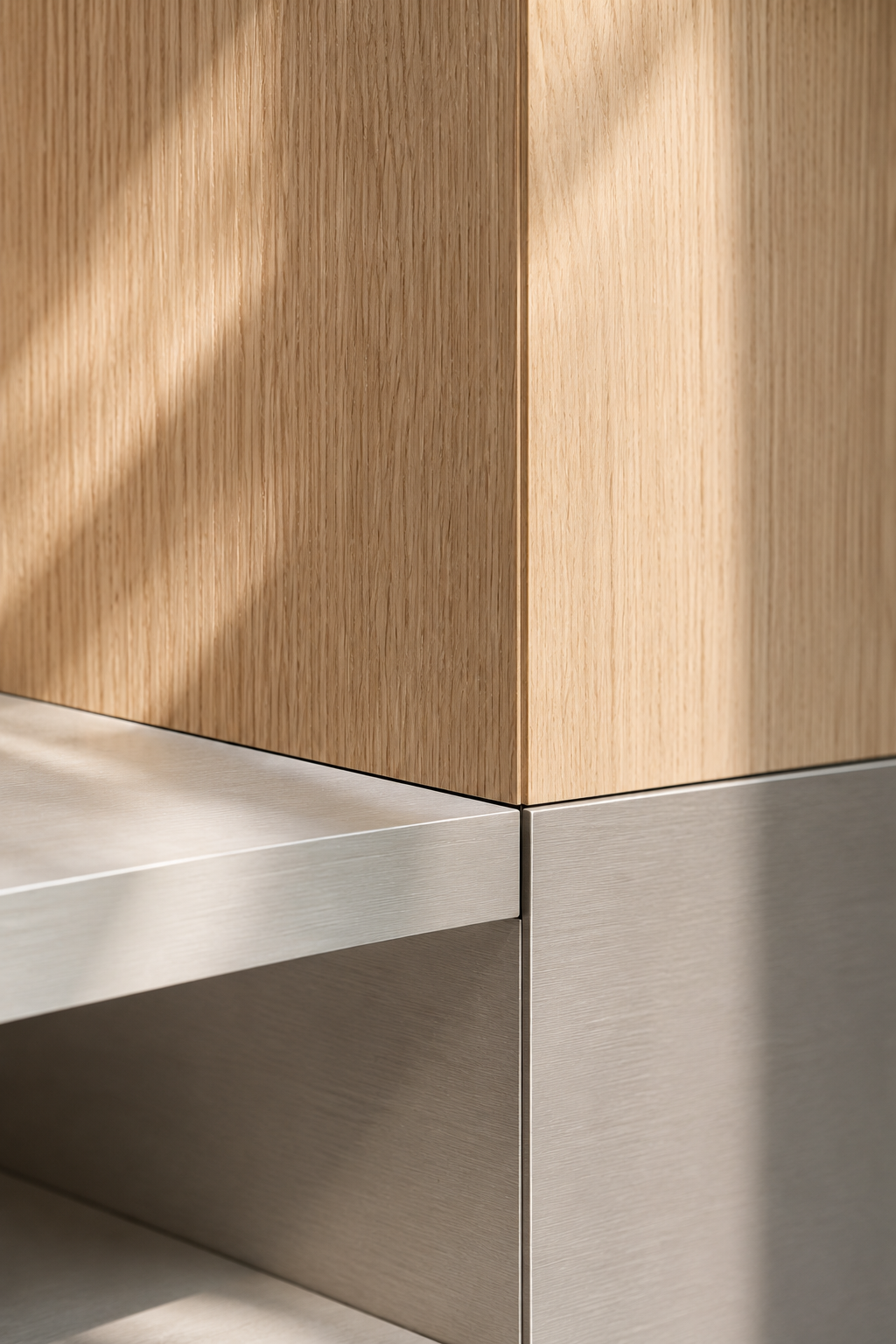 Close-up of a corner of a modern furniture piece with a wooden cabinet on top of a metal base, highlighting the junction and design contrast.