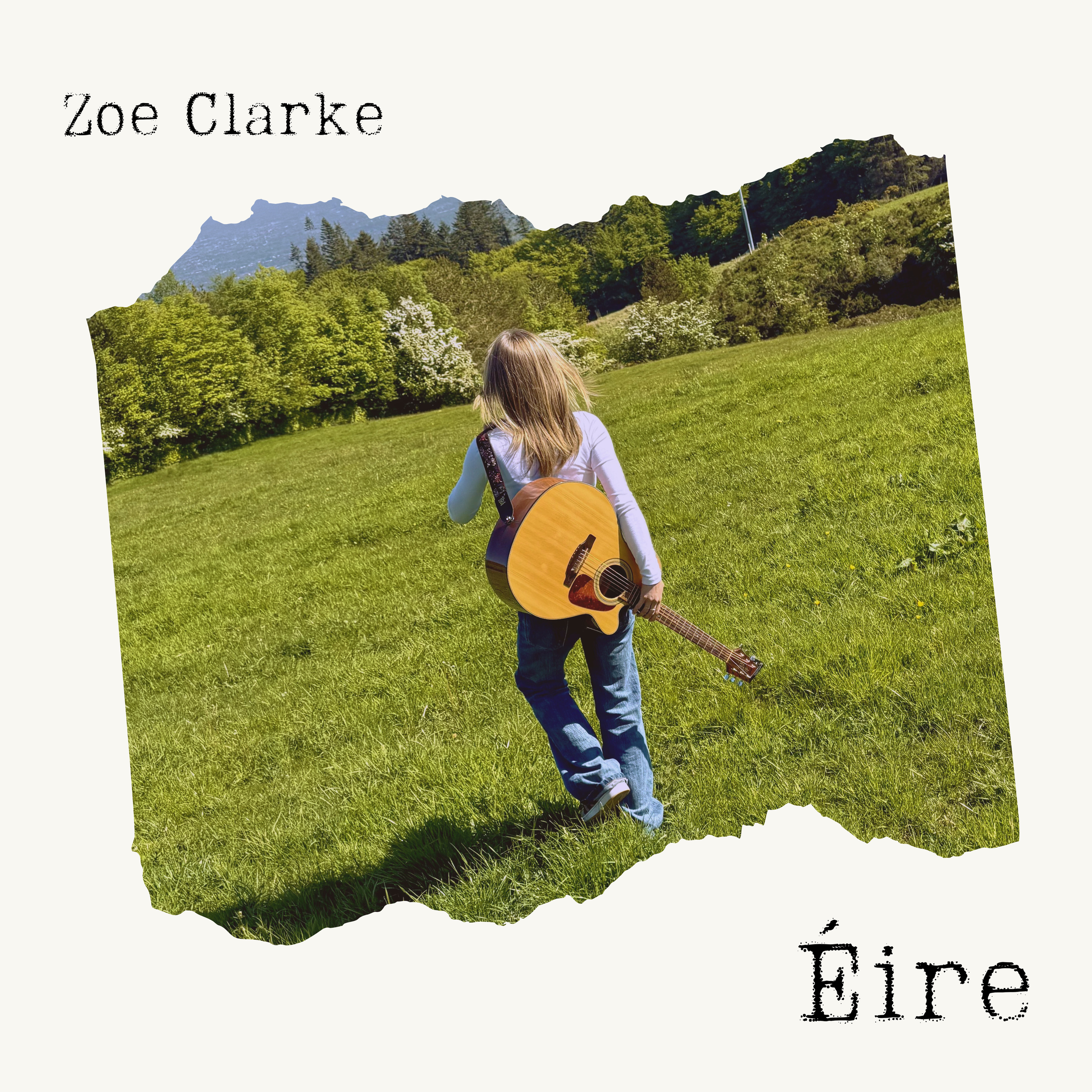 A girl with long hair wearing a white jacket holding a guitar, standing in a grassy field with green trees and mountains in the background, overlaid with the text "Zoe Clarke".