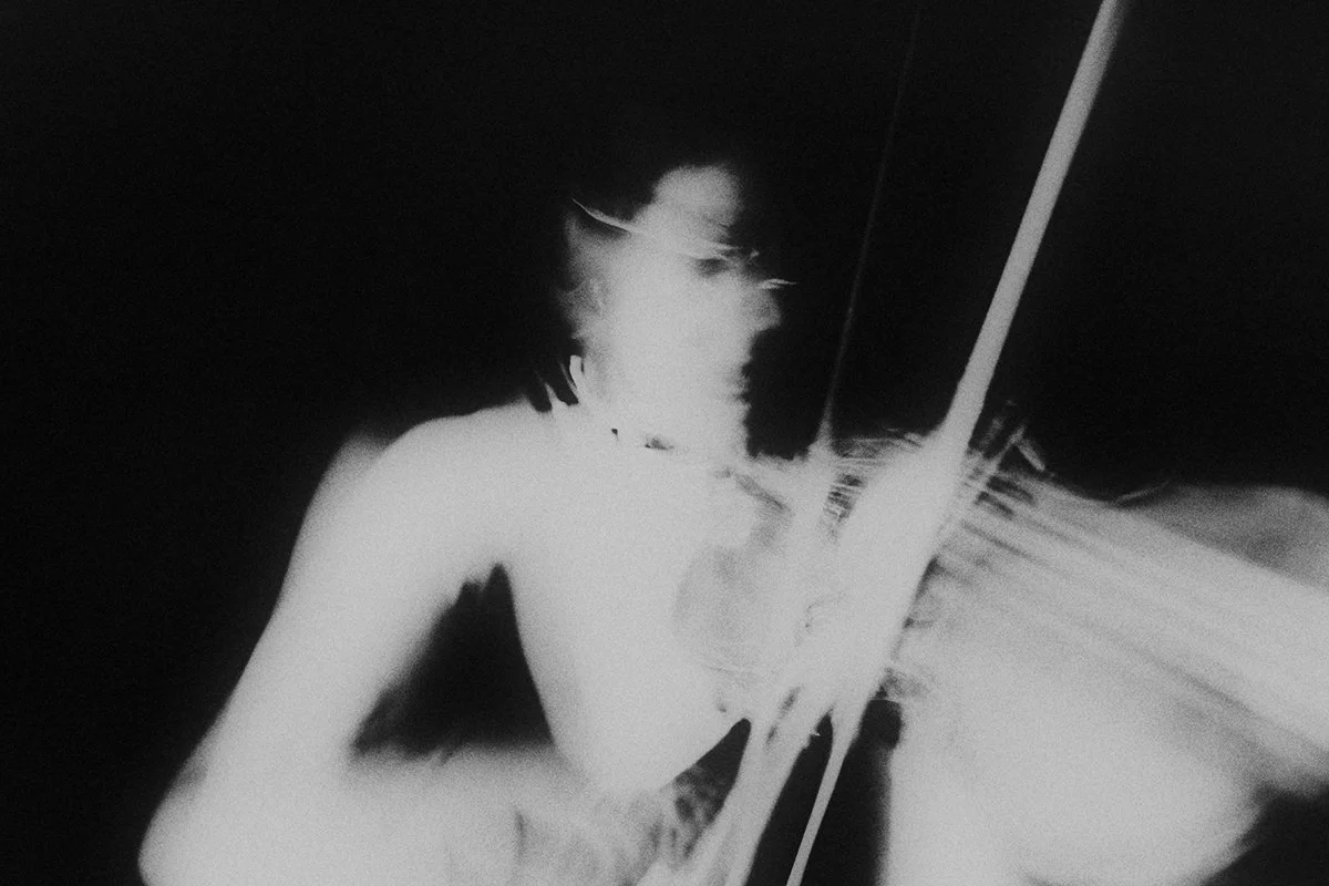 Abstract monochrome portrait exploring identity, presence, memory and transformation.
