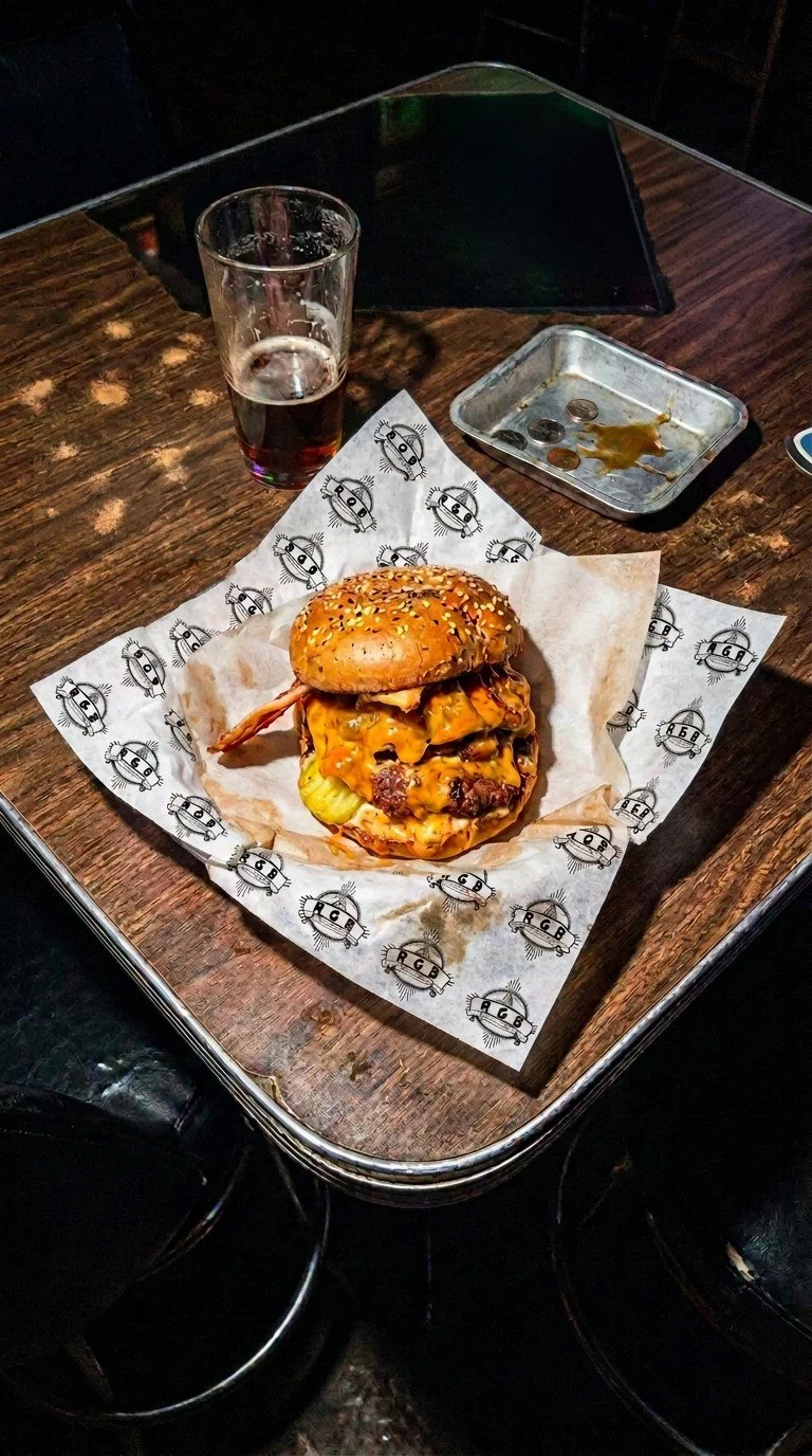 A messy looking burger on a table