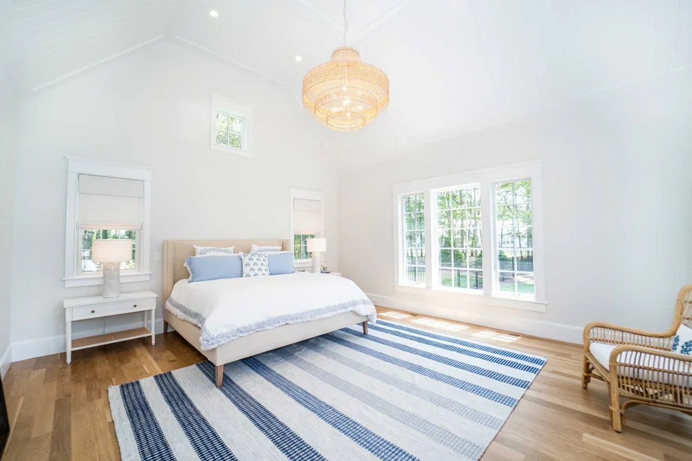 james-golden-oyster-harbors-family-compound-master-bedroom-cathedral-ceiling.webp