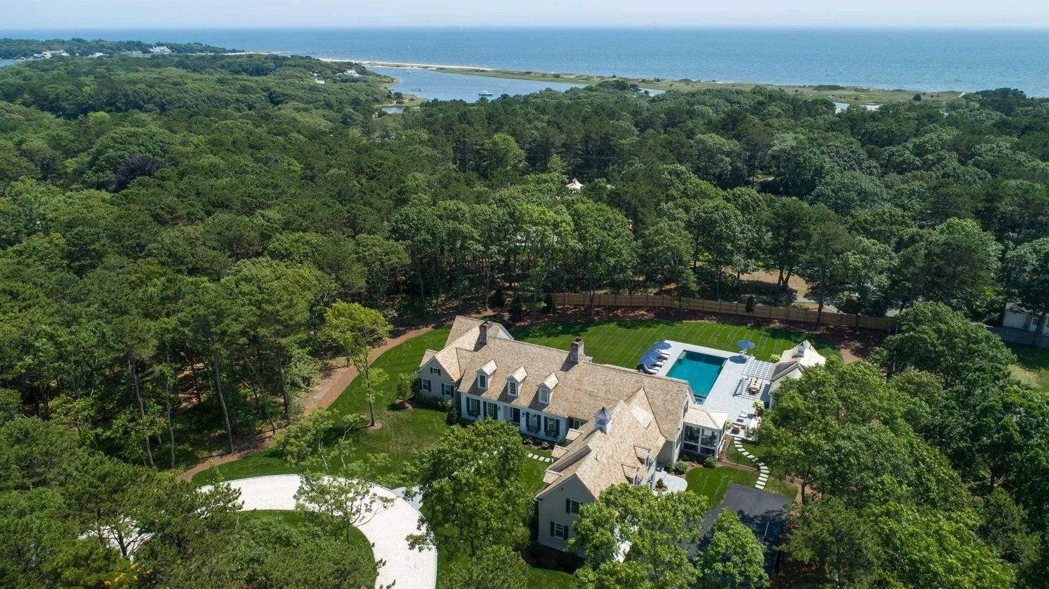 james-golden-oyster-harbors-family-compound-aerial-arrival-driveway.webp
