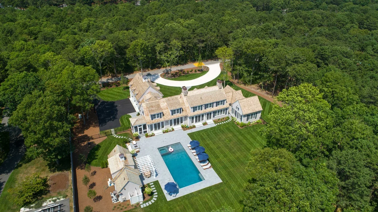 james-golden-oyster-harbors-family-compound-aerial-pool-cabana-outdoor-shower-swimming-pool-back-yard.webp
