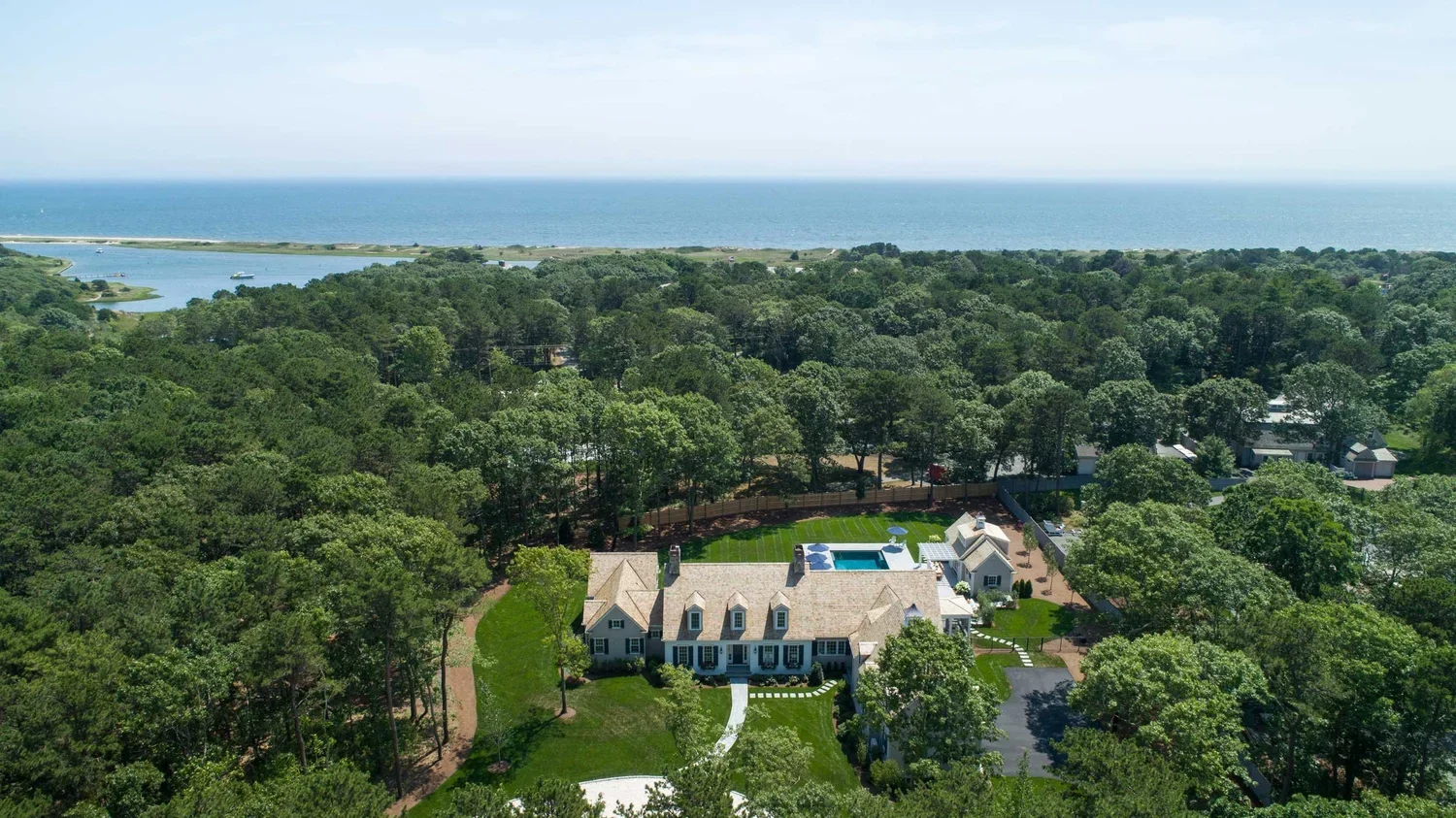 james-golden-oyster-harbors-family-compound-aerial-arrival-driveway-pool-cabana.webp