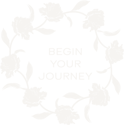 Black background with white floral wreath and the text "Begin Your Journey" in the center.