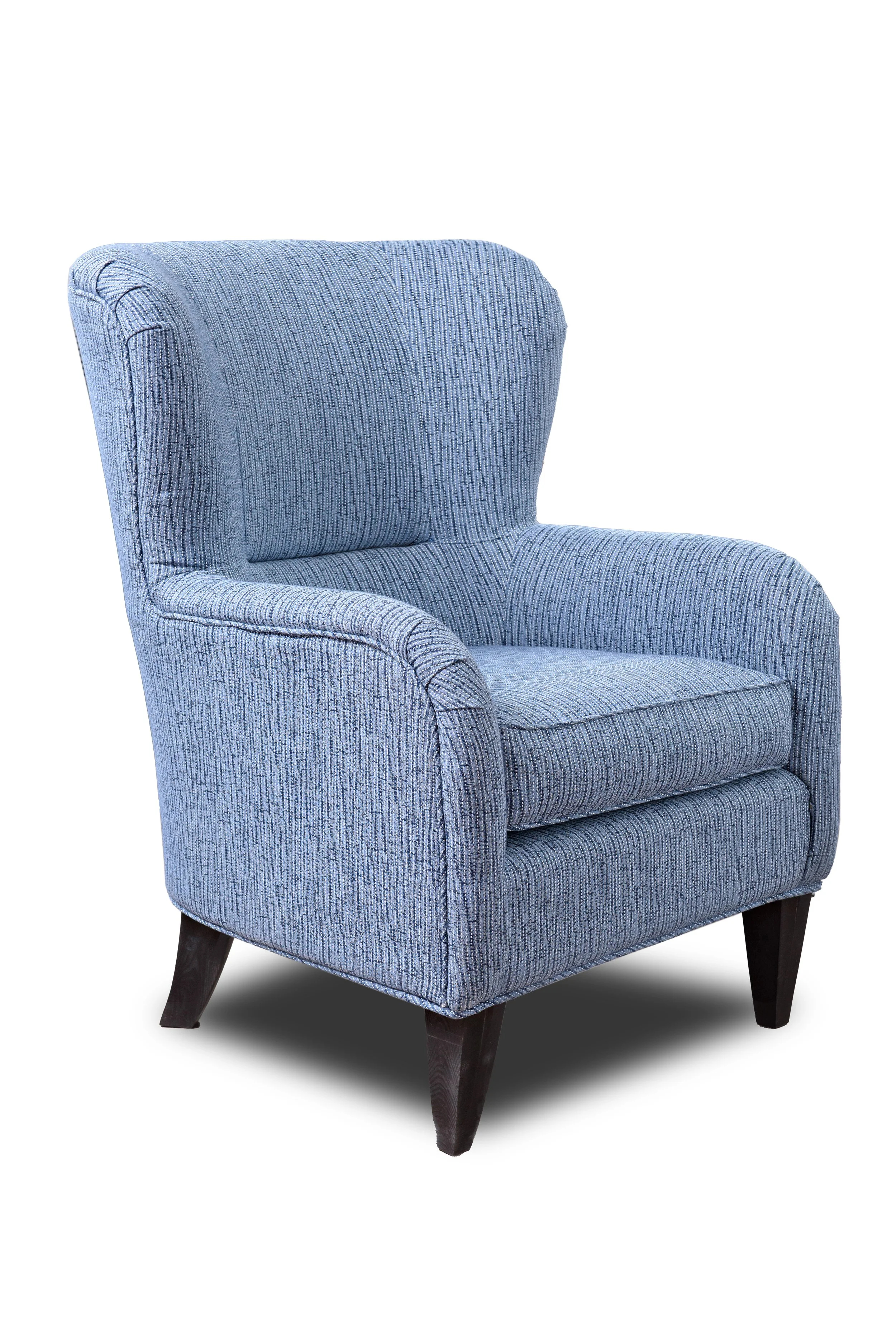 A light blue patterned armchair with dark wooden legs.