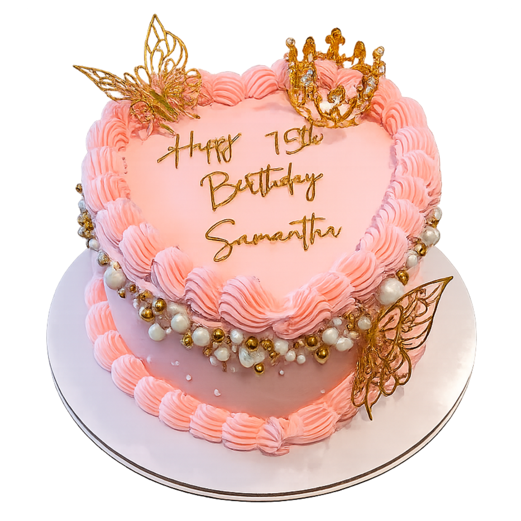 A pink birthday cake decorated with gold accents, a butterfly and a crown toppers, surrounded by piped frosting and pearl-like beads on a white plate.