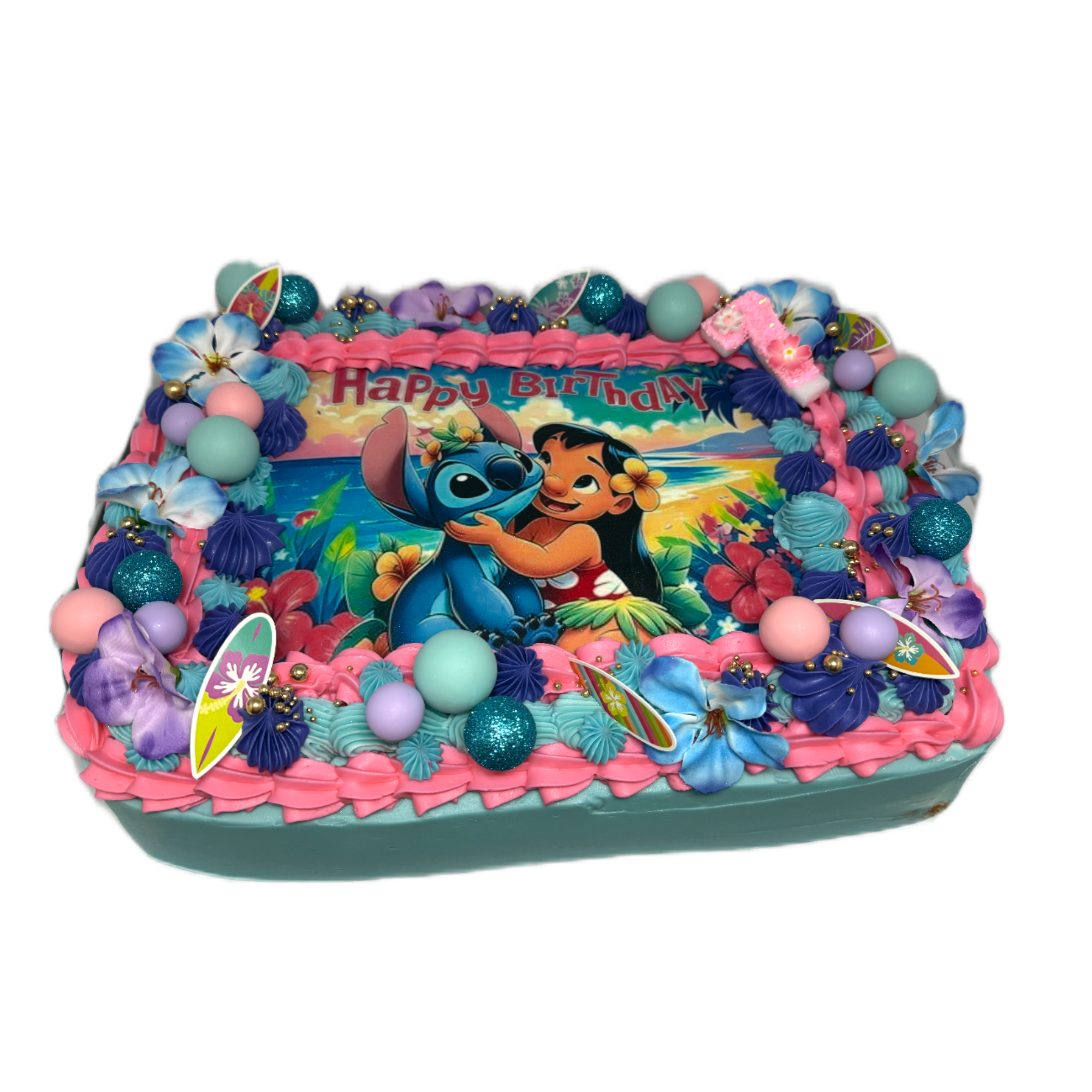 Colorful Lilo and Stitch themed birthday cake decorated with blue, pink, and purple icing, foam balls, floral accents, and a "Happy Birthday" sign.