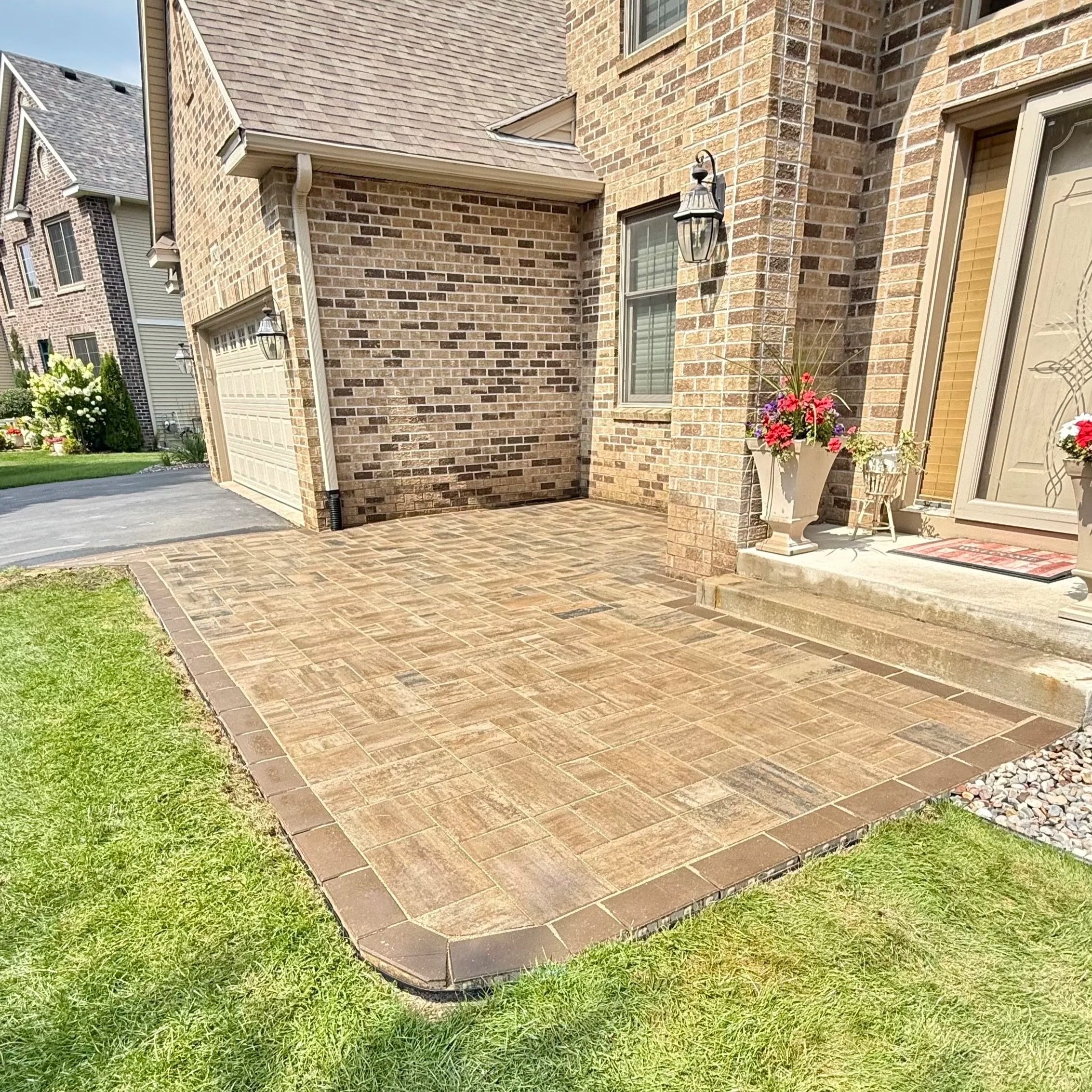 Beautiful front patio leading from the drive-way to the front steps of home. 