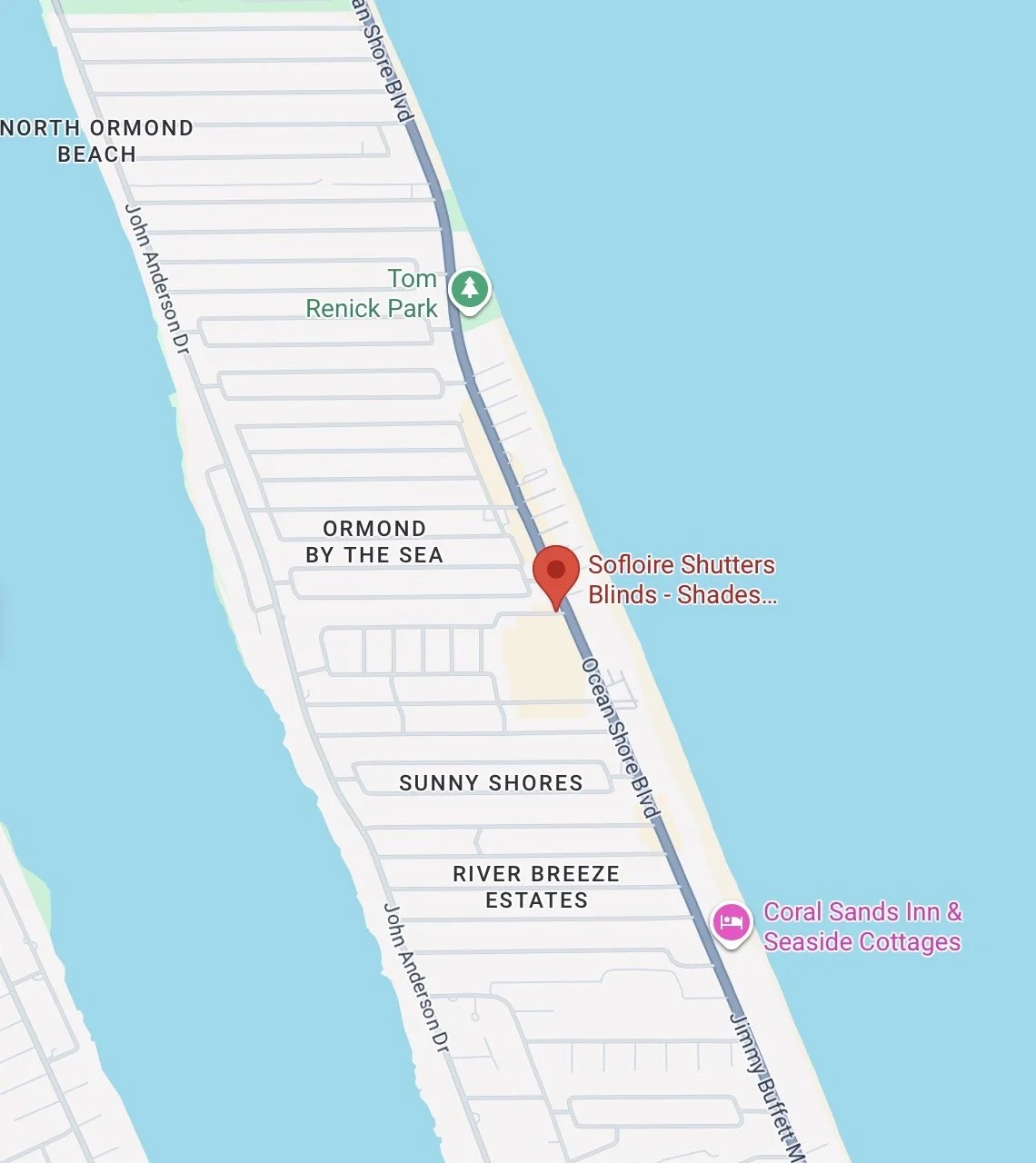 Map showing a route along Ocean Shore Blvd near the coast, passing through neighborhoods such as North Ormond Beach, Ormond by the Sea, Sunny Shores, and River Breeze Estates. Landmarks include Tom Renick Park and Coral Sands Inn & Seaside Cottages, with a red marker indicating Sofloire Shutters Blinds Shades.