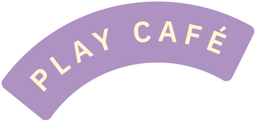 A purple curved sign with the words 'PLAY CAFE' in cream-colored capital letters.