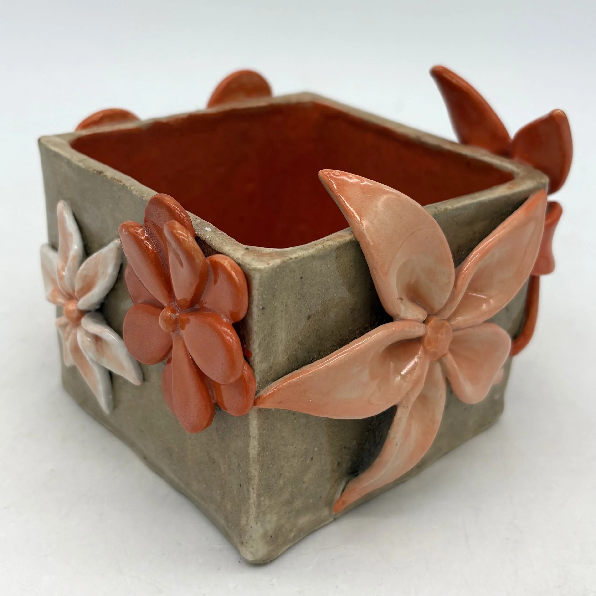 Small (3.5" x 3.5" x 3") orange box. $150