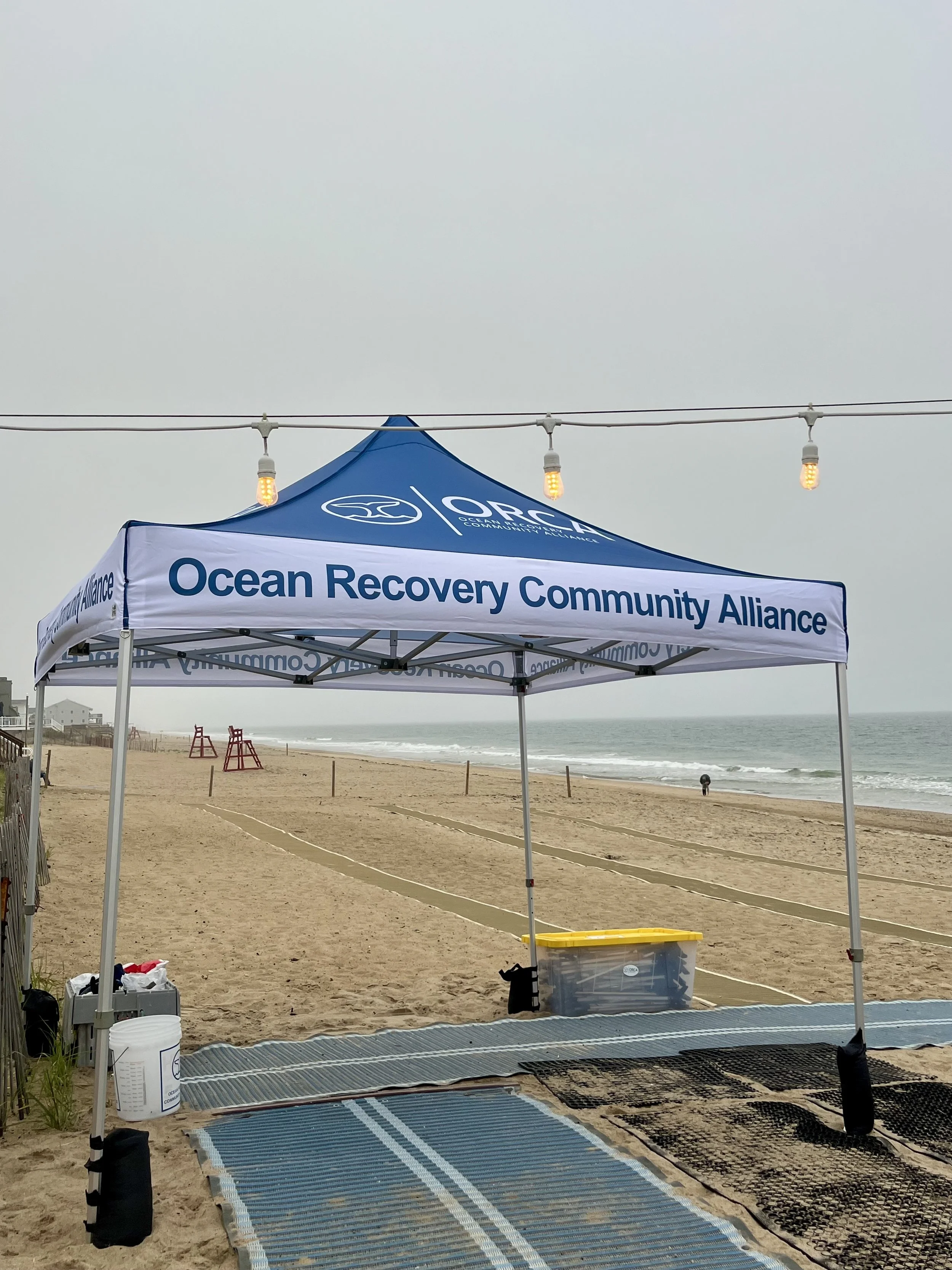 ORCA beach cleanup tent setup on Misquamicut Beach in Rhode Island