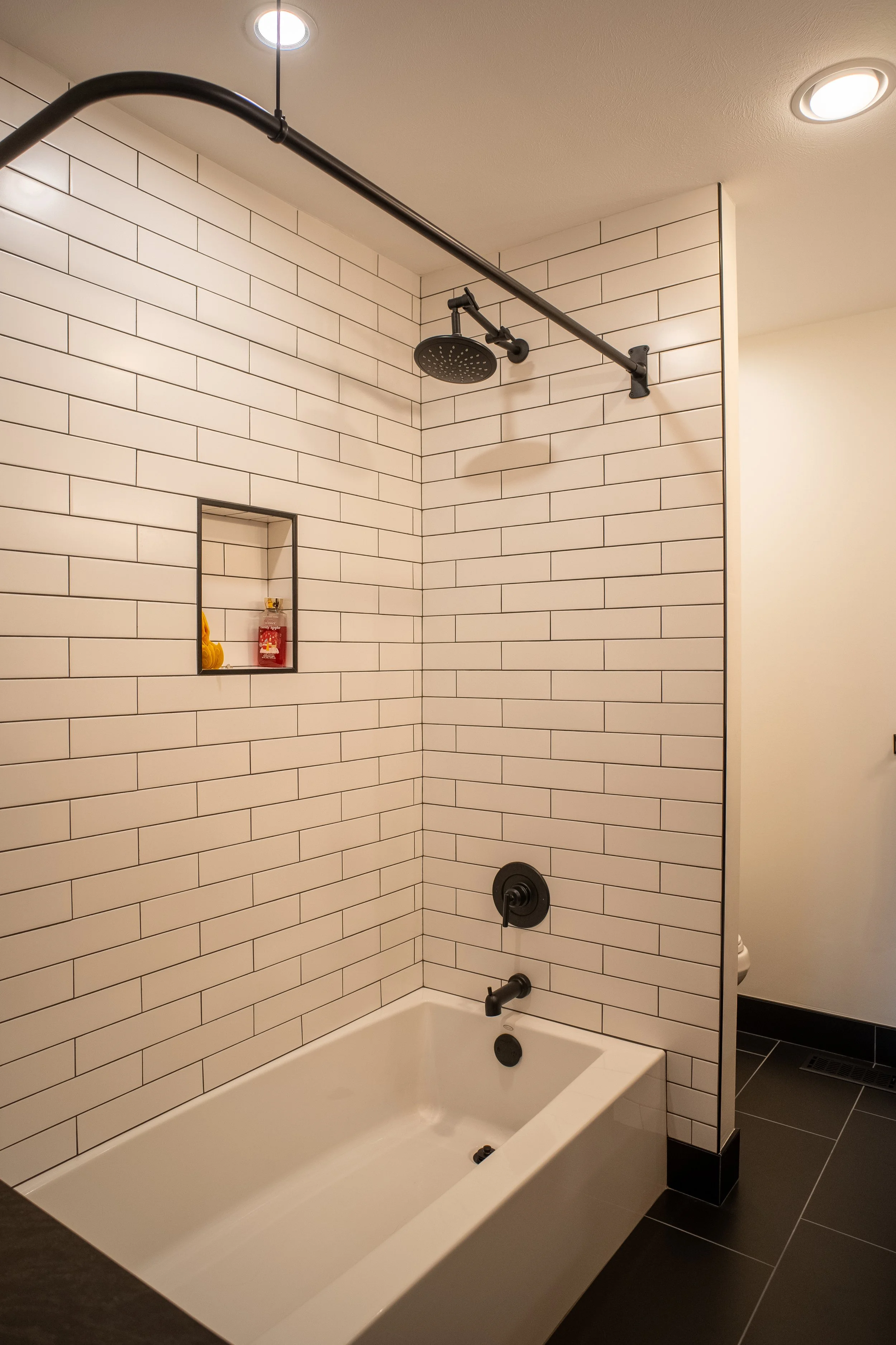 Modern Bathroom 
Construction 
White and Black Shower 
Shower with Tub 
Modern Design 
Kansas Construction 
Design and Construction 