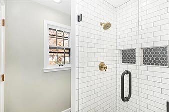 Modern Bathroom 
White Shower 
Construction 
Modern Design 
Kansas Construction 
Design and Construction 