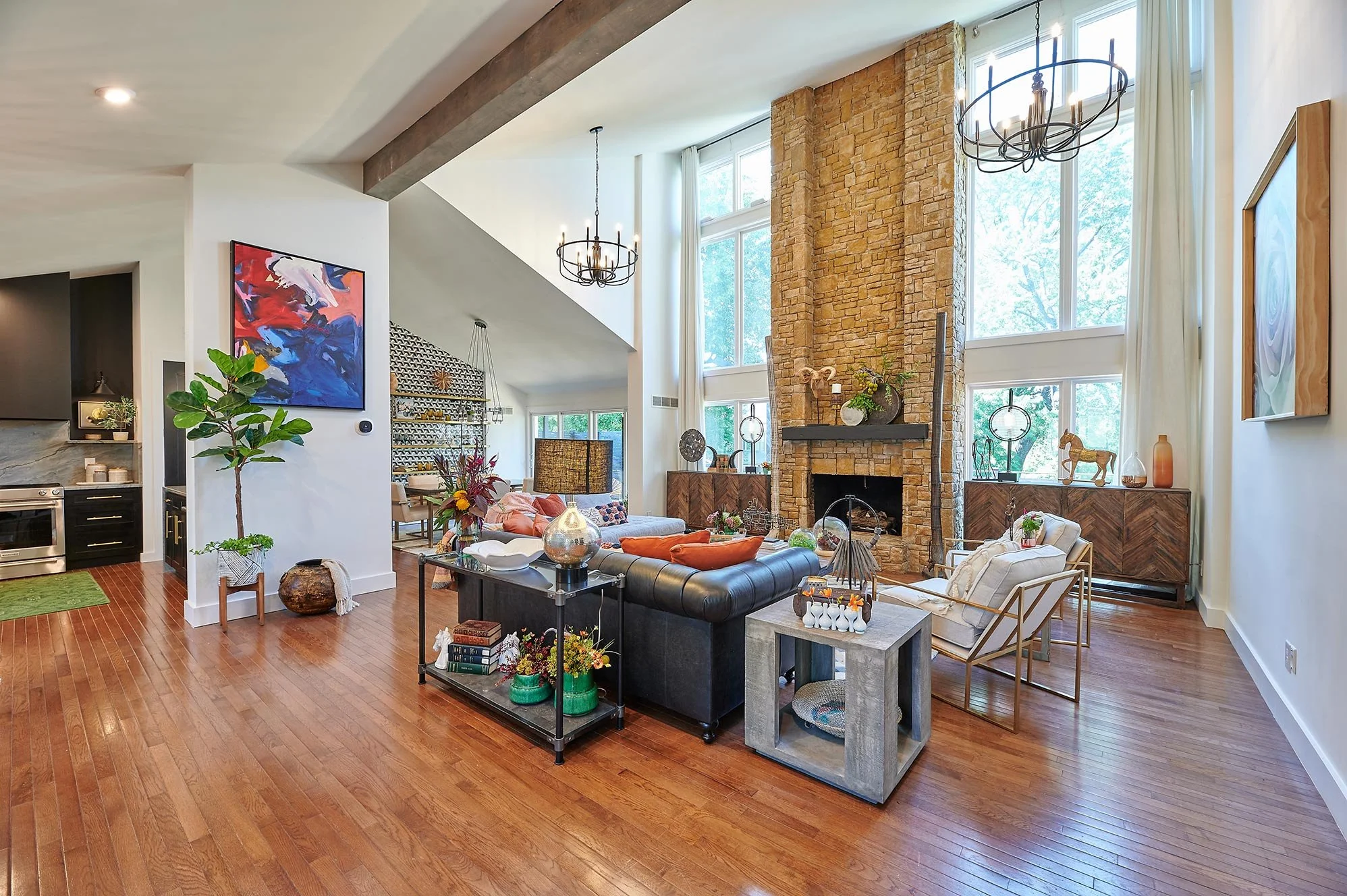 Modern Living Room 
Open Living Room 
White Living Room 
Wood Floors 
Modern Fire pit 
High Ceiling Living Room 
Construction 
Modern Design 
Kansas Construction 
Design and Construction