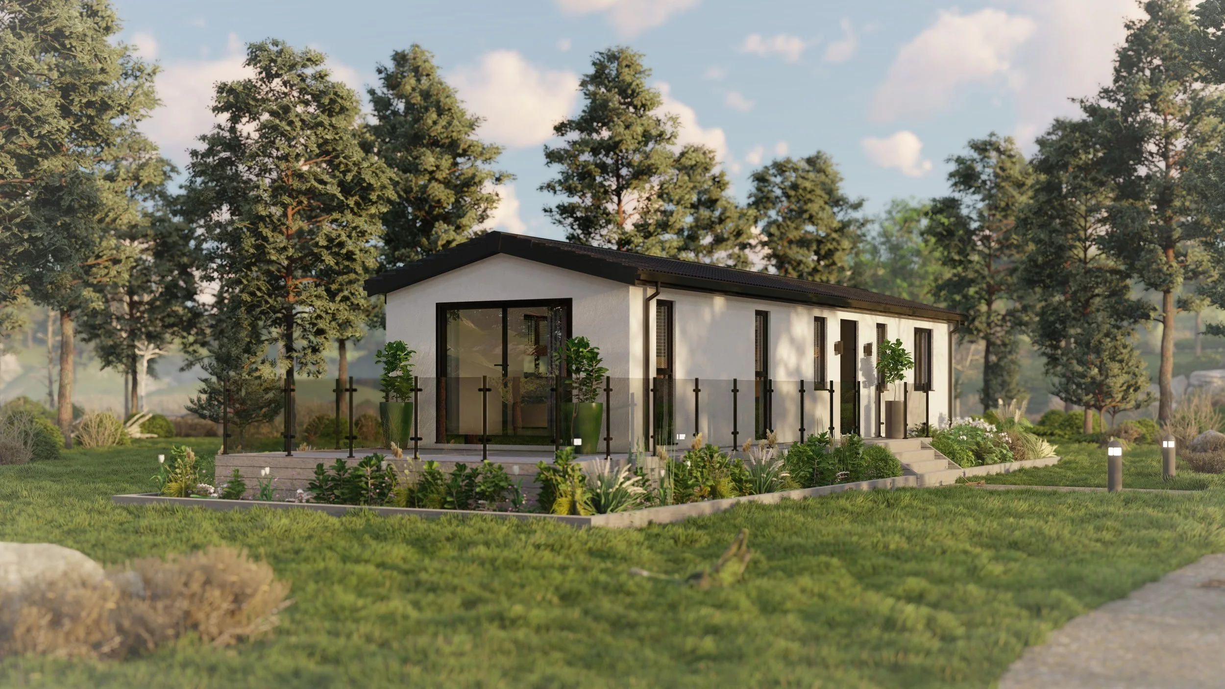 Modern single-story house with white exterior, large glass doors, surrounded by landscaped garden with various plants and trees, set in a green yard under a partly cloudy sky.