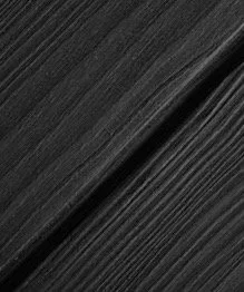 Close-up of black vinyl records stacked together