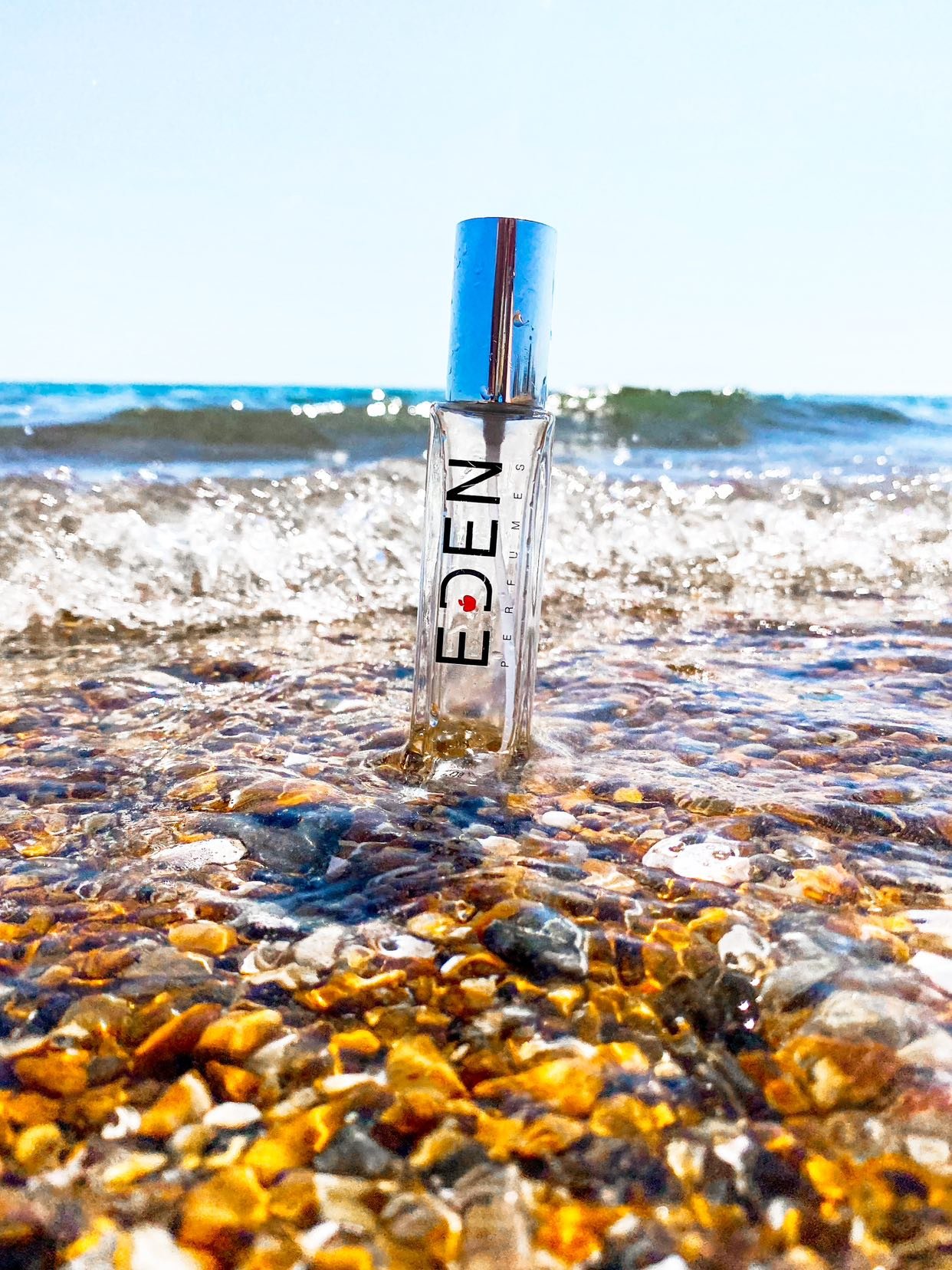 Eden Perfumes brand campaign lookbook featuring cruelty free fragrance bottles and botanical lifestyle photography