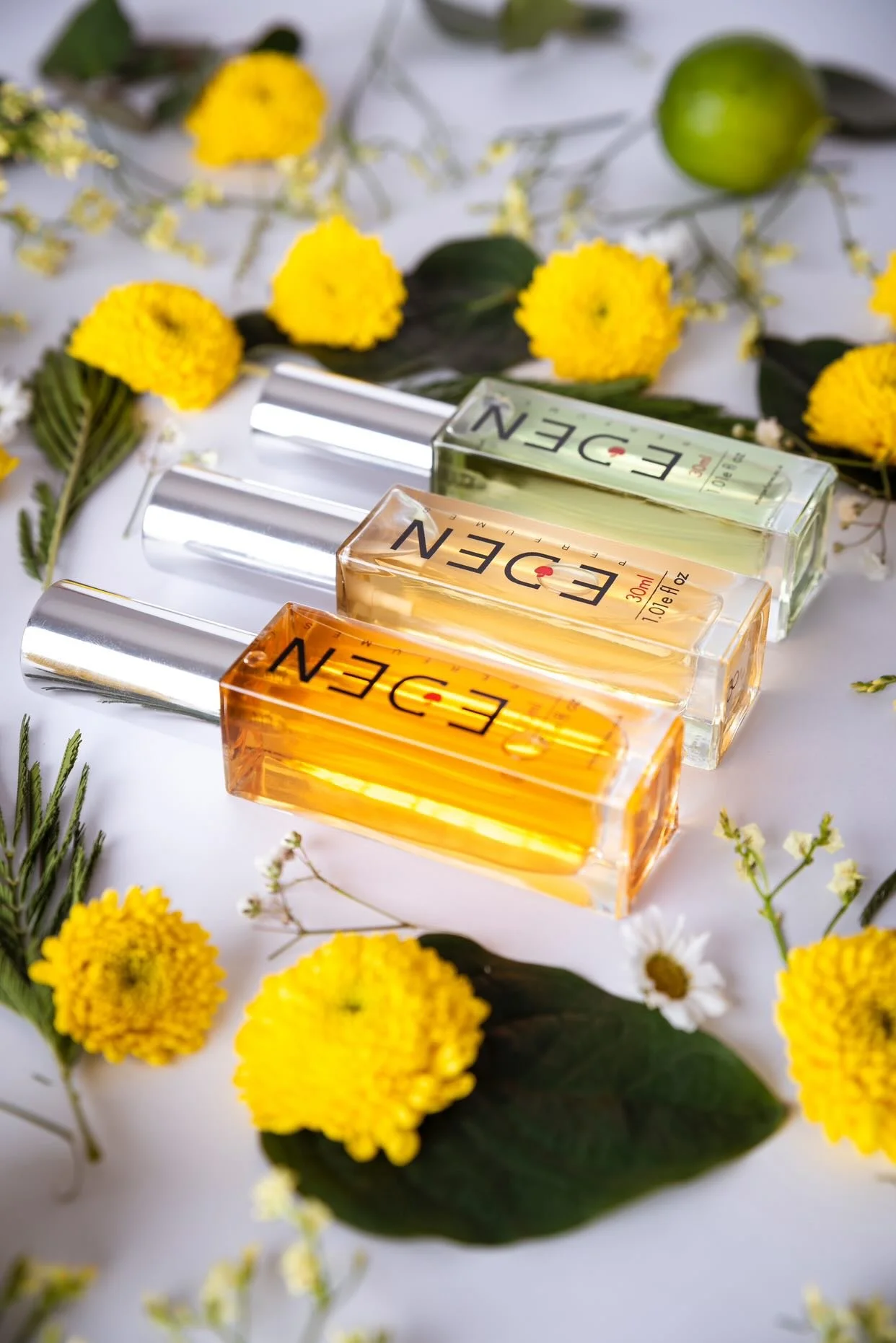 Eden Perfumes brand campaign lookbook featuring cruelty free fragrance bottles and botanical lifestyle photography