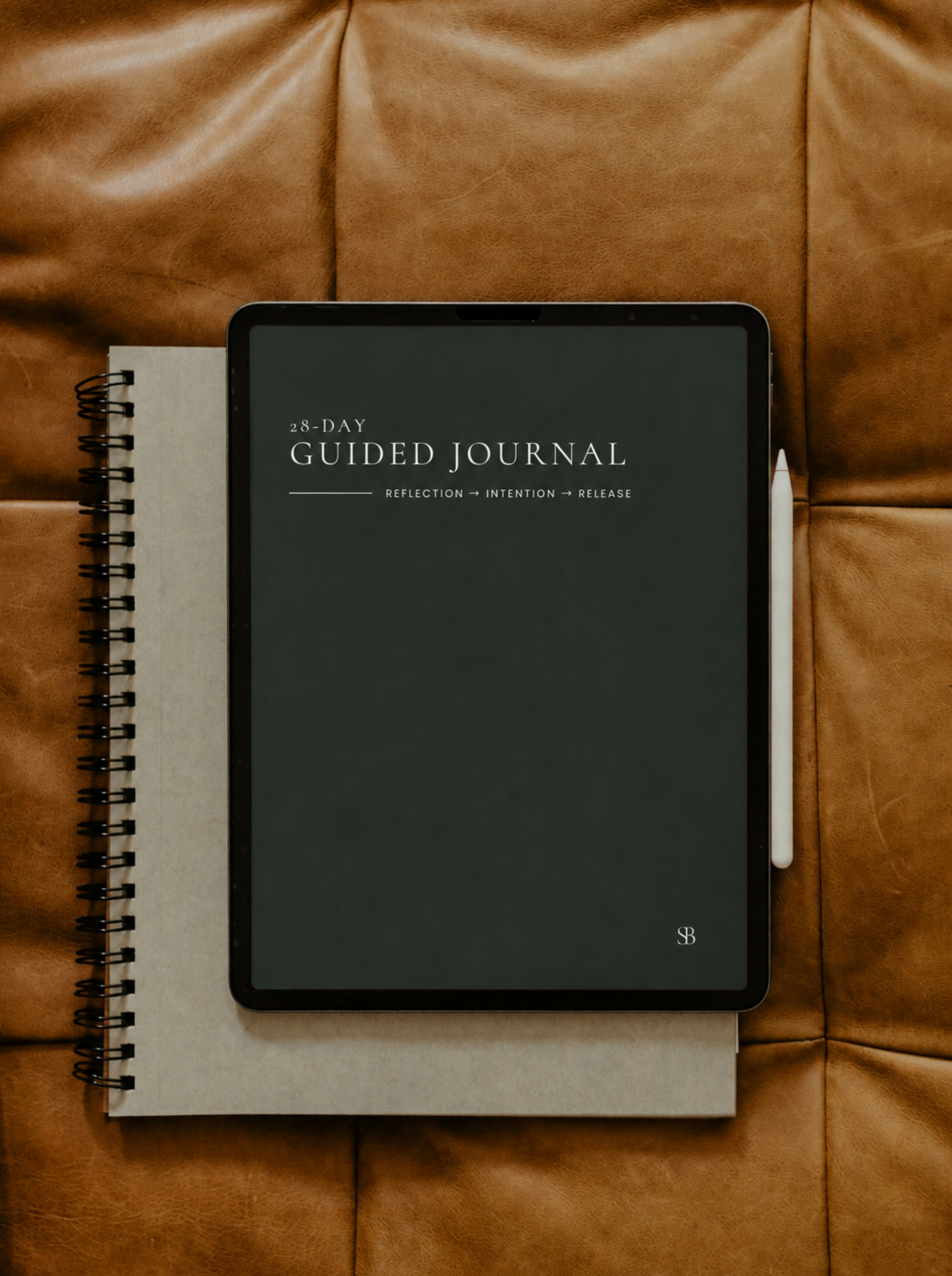 28-Day Guided Journal displayed on a tablet beside a printed journal