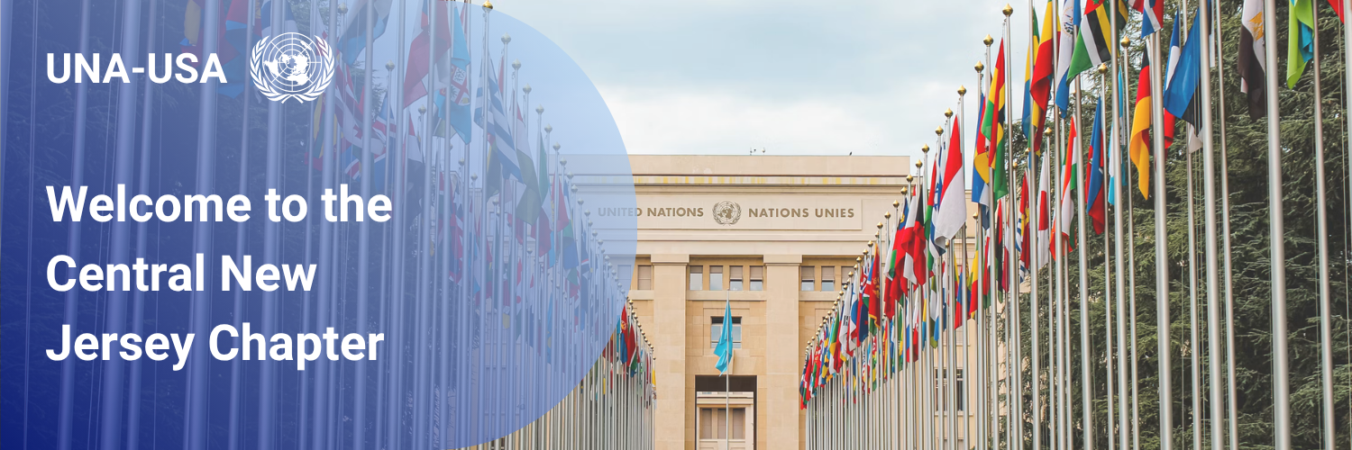 Photo of the United Nations headquarters with colorful flags from various countries lining the entrance, and a sign welcoming to the Central New Jersey Chapter of UNA-USA.