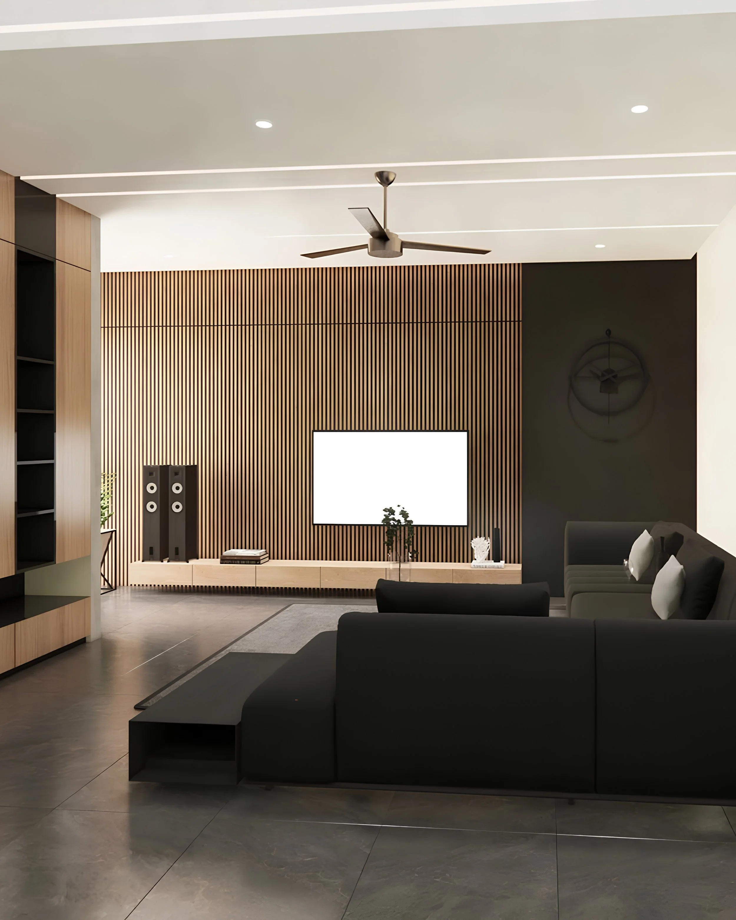 Modern living room with black sofa, white pillows, wooden slat wall, flat-screen TV, small plants, and contemporary decor.