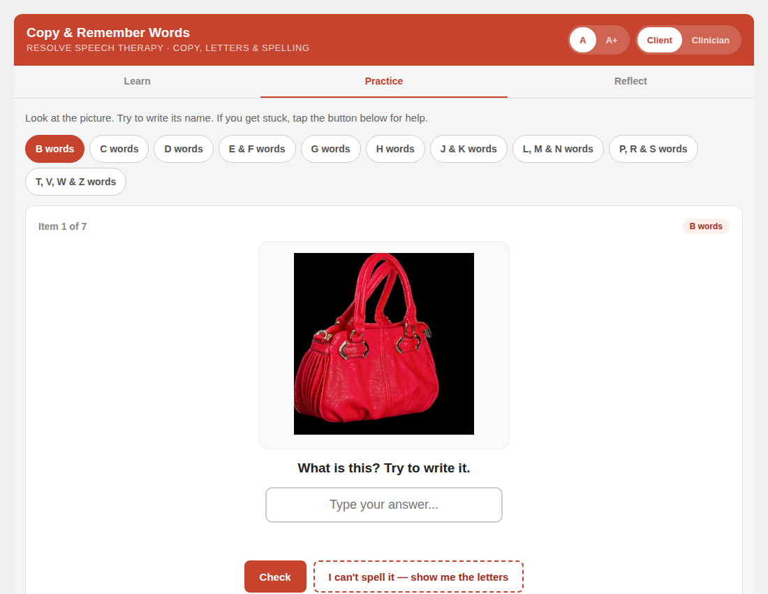 Red handbag with double handles and gold hardware on a black background.