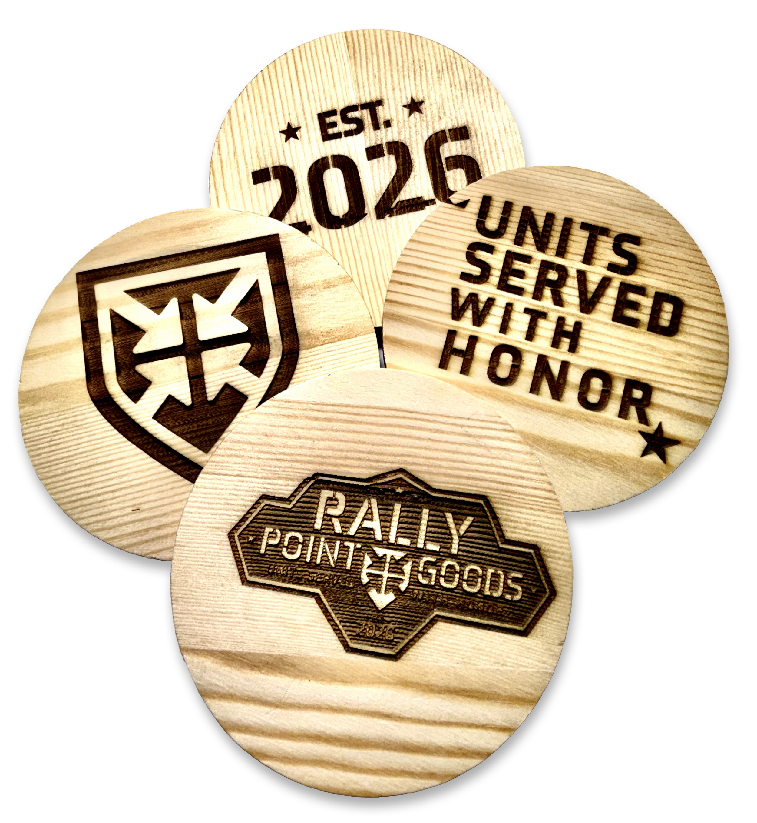 Several round wooden plaques with laser-engraved designs and text, including a Disneyland park map, a 'Built and operated with honor' message, a '2026 EST.' indicating an estimated completion year, and a shield emblem.