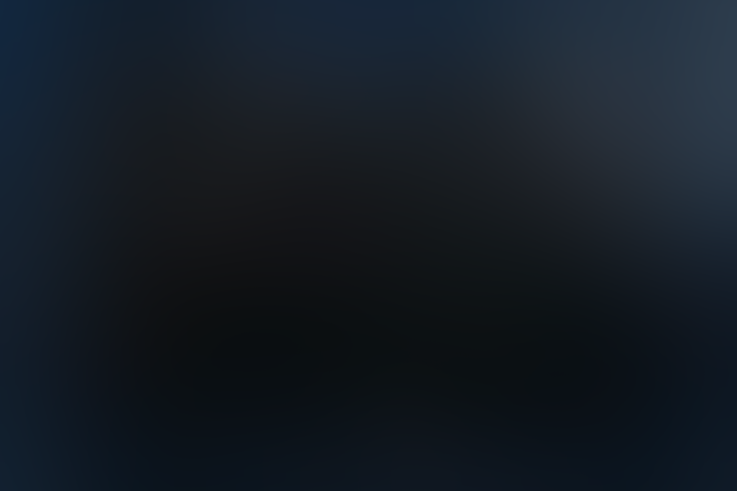 Blurry dark background with no discernible objects.