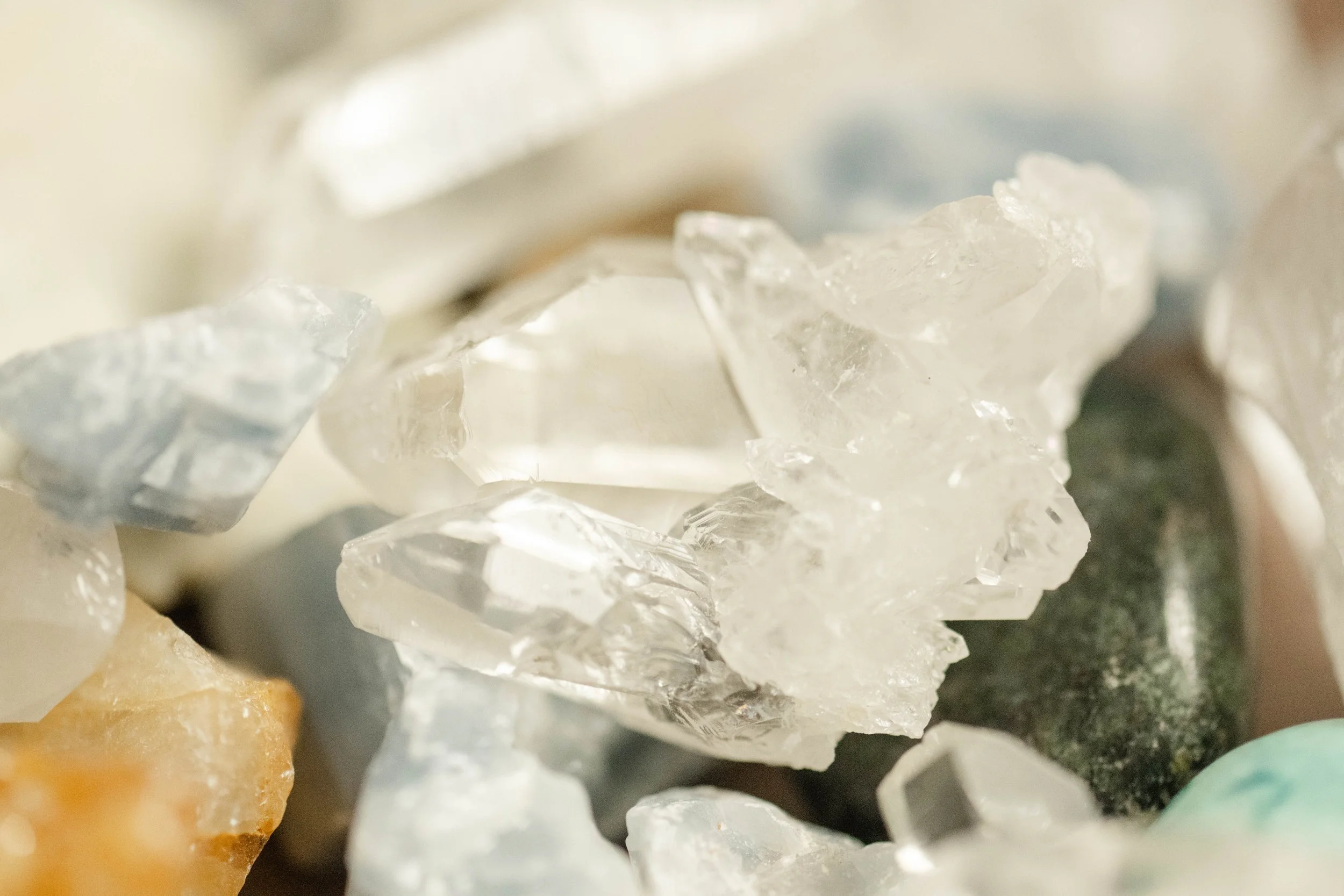 Close-up of various minerals and crystals, including clear quartz.